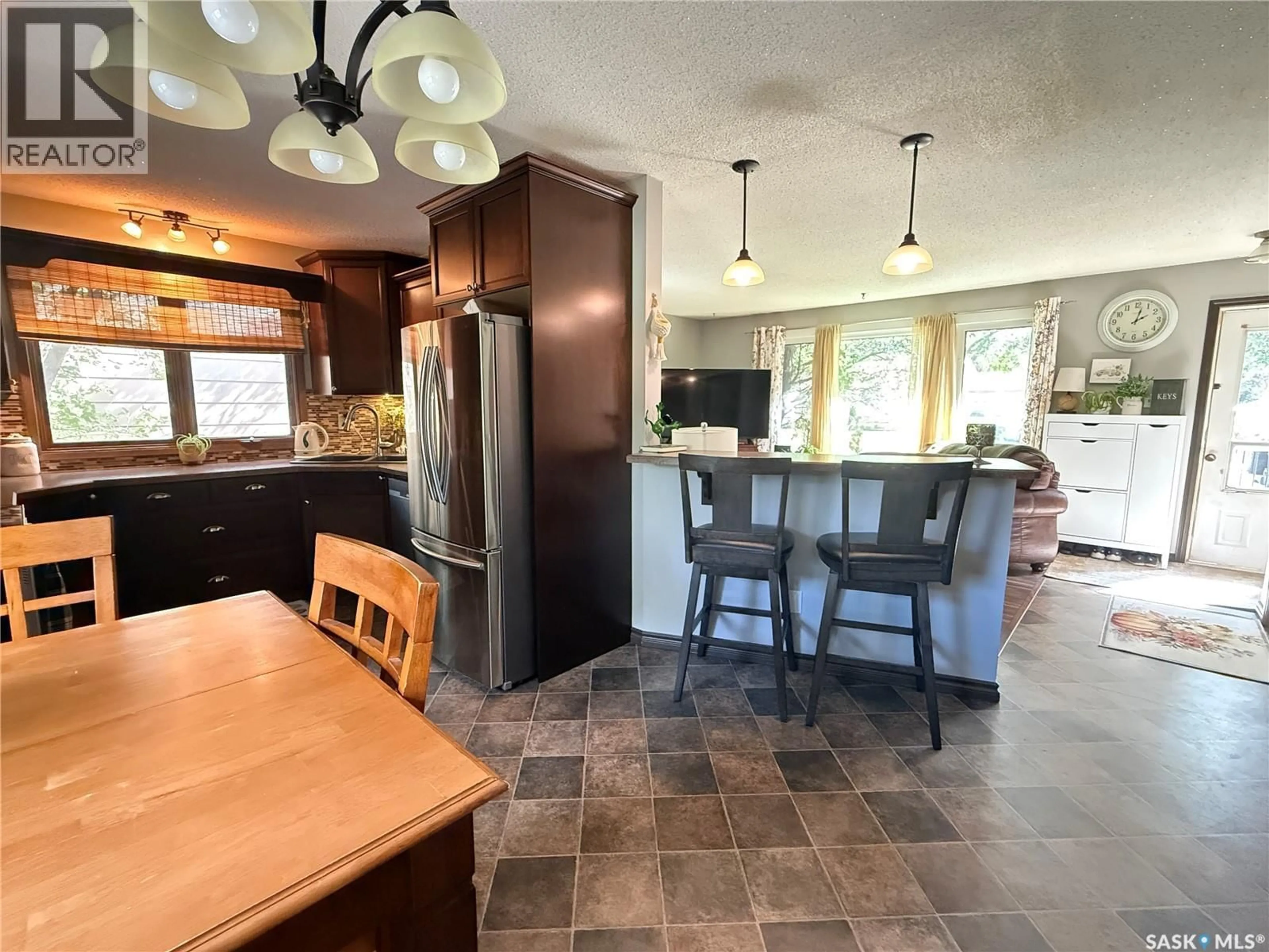 Open concept kitchen, ceramic/tile floor for 1709 EAGLESHAM AVENUE, Weyburn Saskatchewan S4H2W8