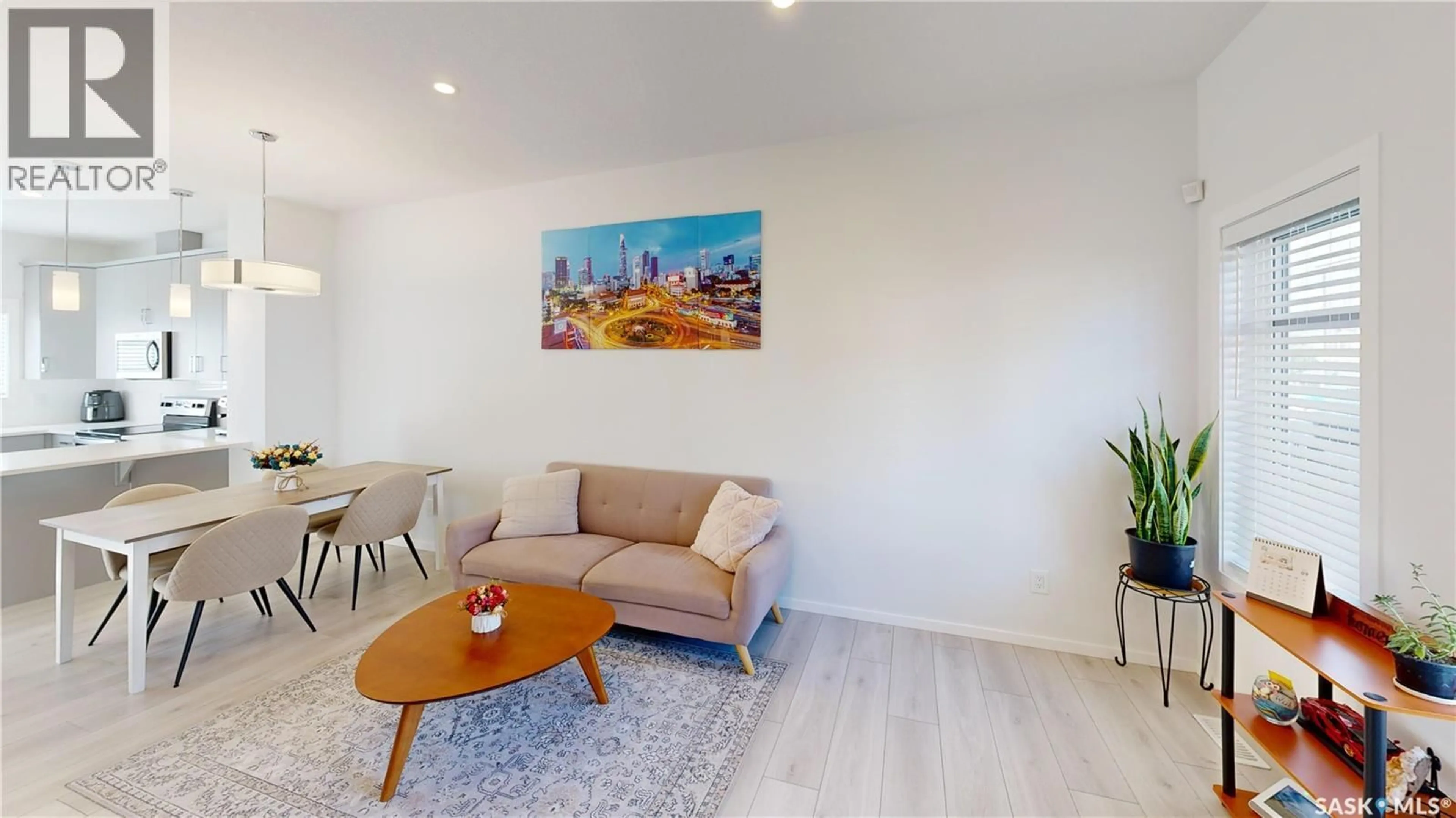 Living room with furniture, wood/laminate floor for 3063 TROMBLEY STREET, Regina Saskatchewan S4V3V7