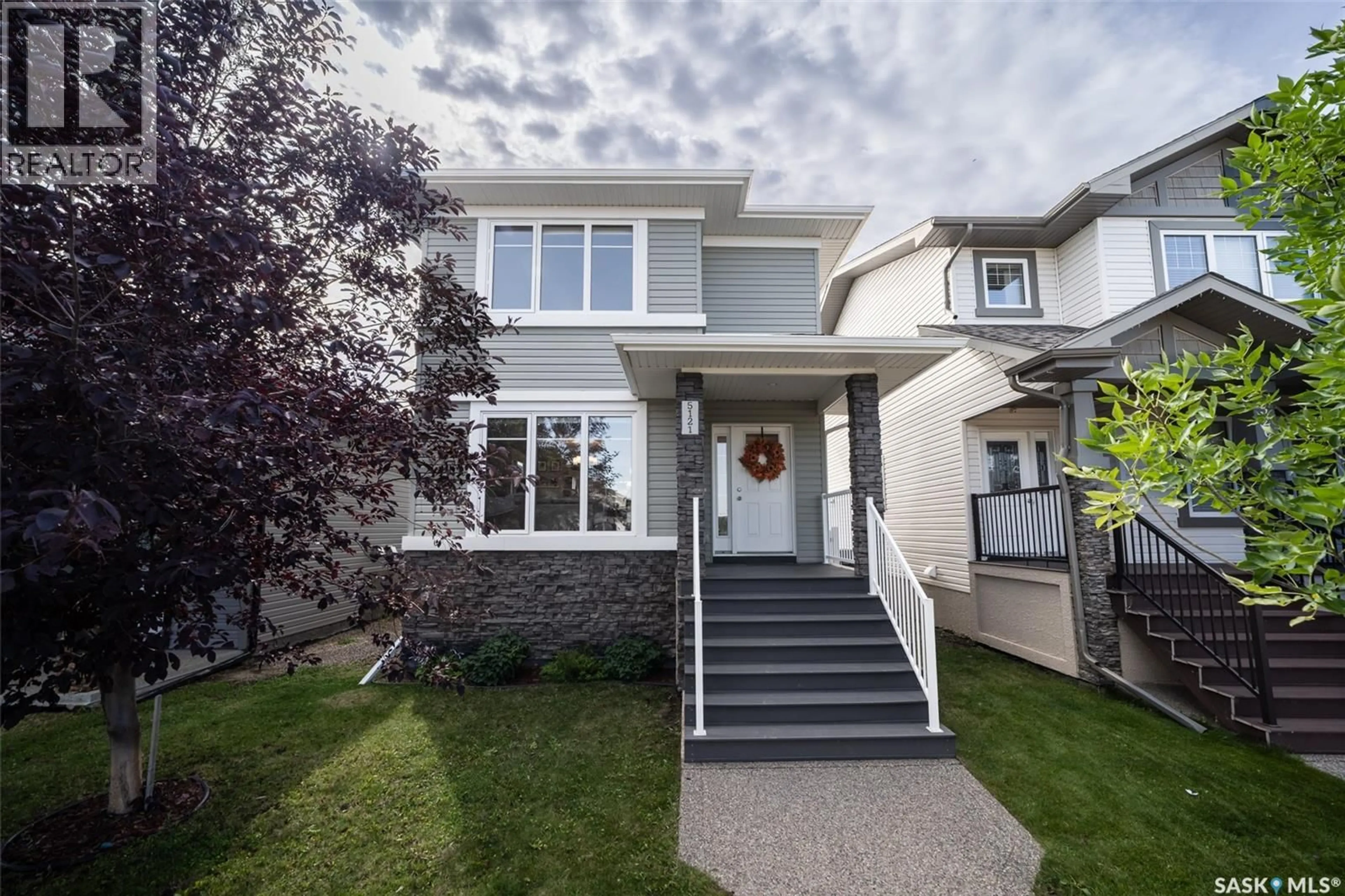 Home with vinyl exterior material, street for 5121 CAMPLING AVENUE, Regina Saskatchewan S4W0L6