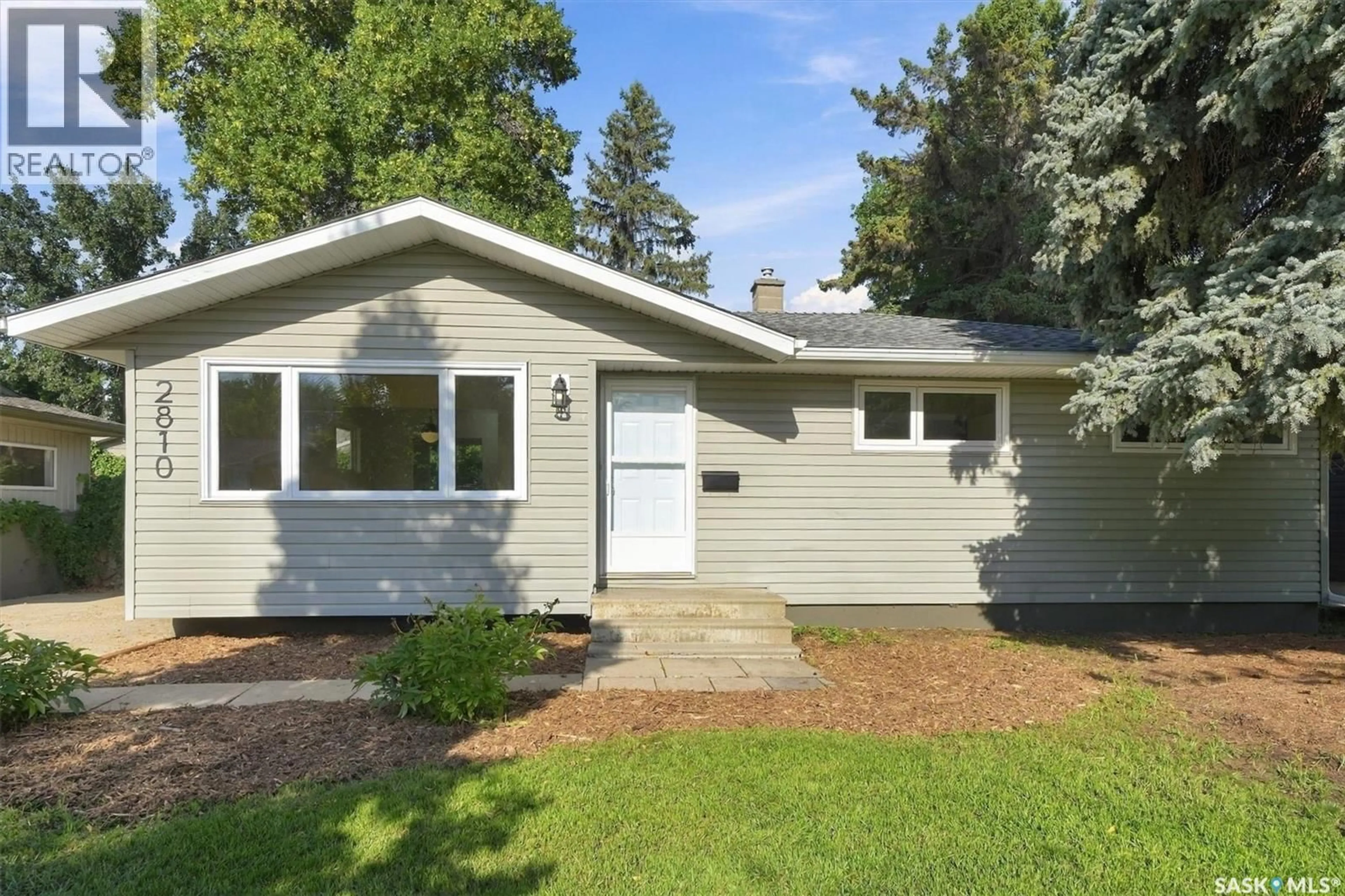 Home with vinyl exterior material, street for 2810 CALDER AVENUE, Saskatoon Saskatchewan S7J1W1