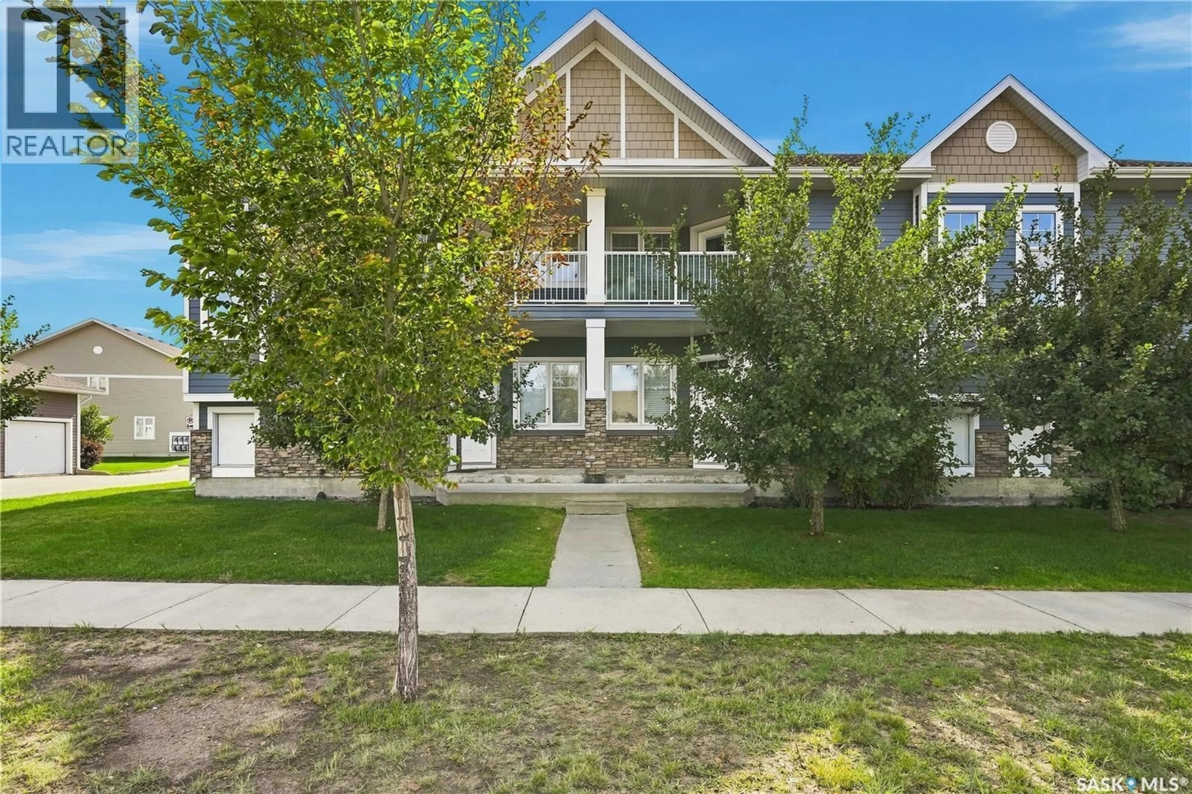 A pic from outside/outdoor area/front of a property/back of a property/a pic from drone, unknown for E - 4199 GREEN APPLE DRIVE, Regina Saskatchewan S4V1S1