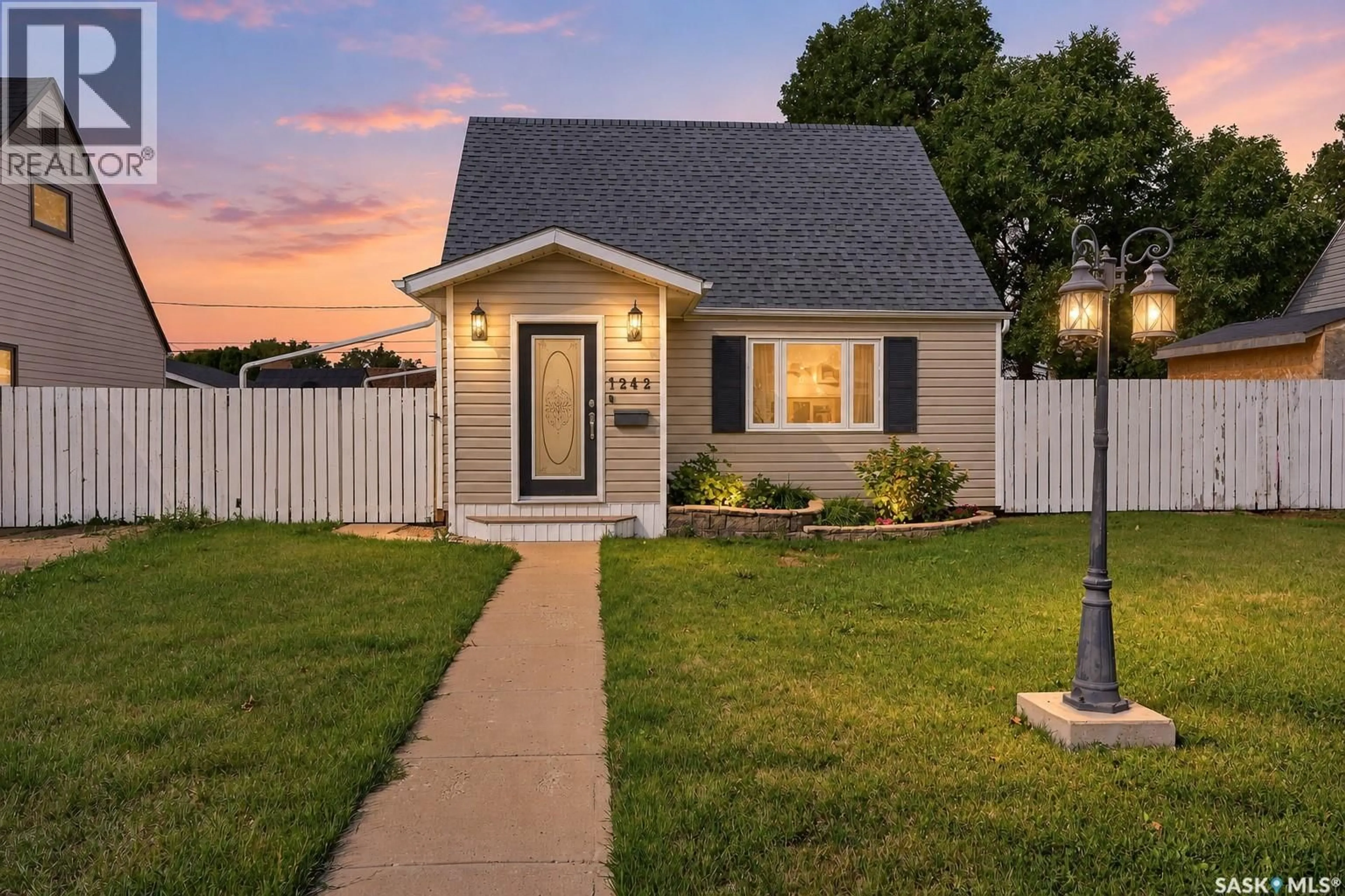 Home with vinyl exterior material, street for 1242 4TH AVENUE, Moose Jaw Saskatchewan S6H1J4
