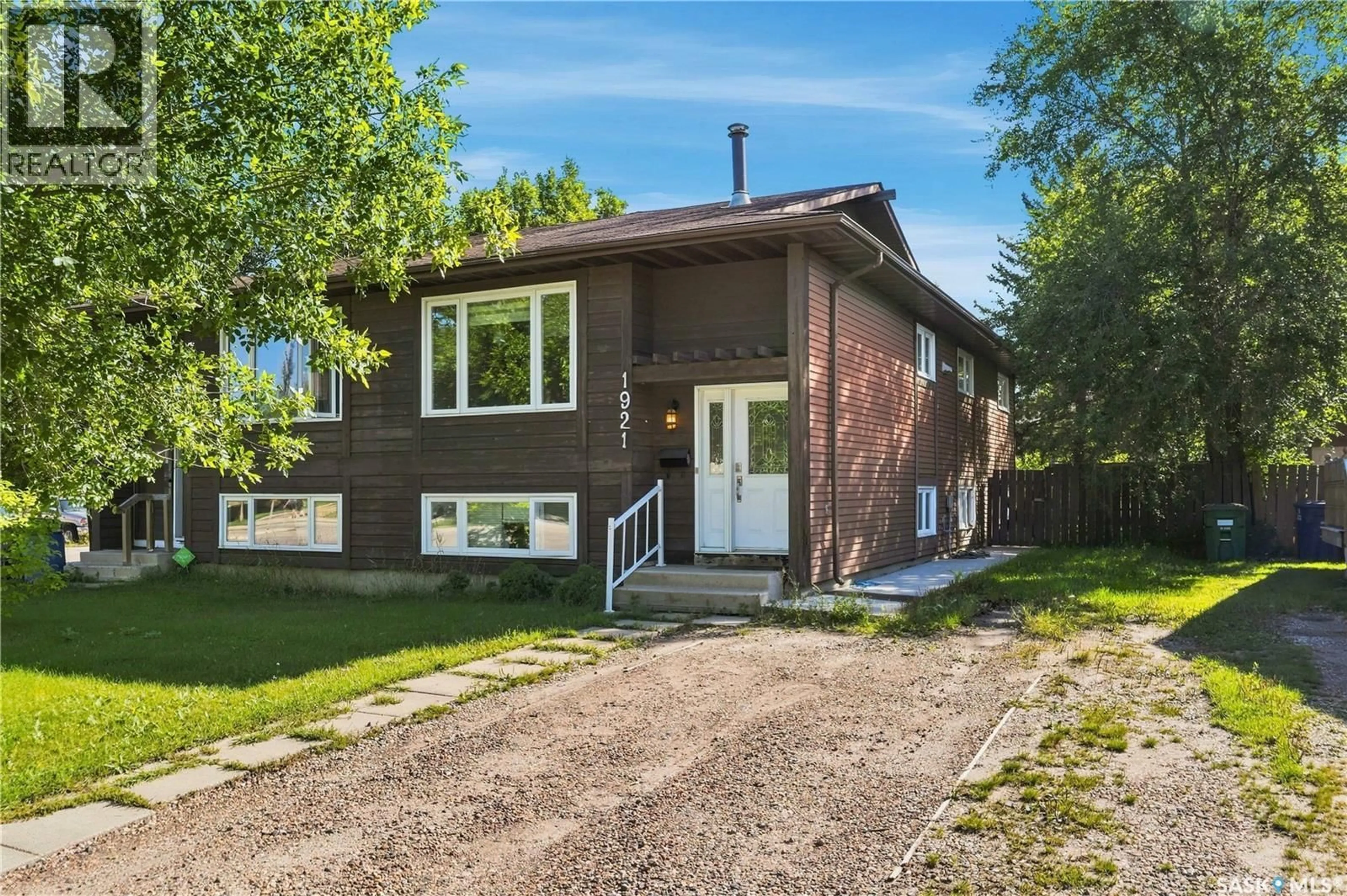 Home with brick exterior material, street for 1921 MCKERCHER DRIVE, Saskatoon Saskatchewan S7J3W1