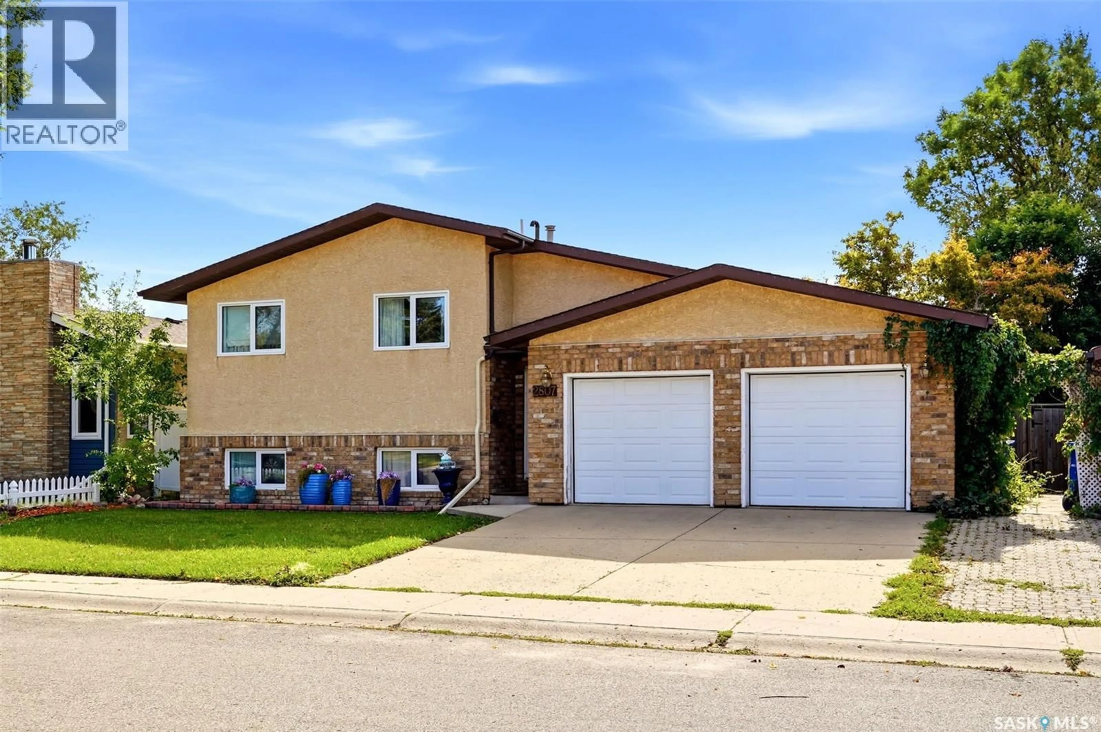 Home with vinyl exterior material, street for 2807 HOWELL DRIVE, Regina Saskatchewan S4N6G1
