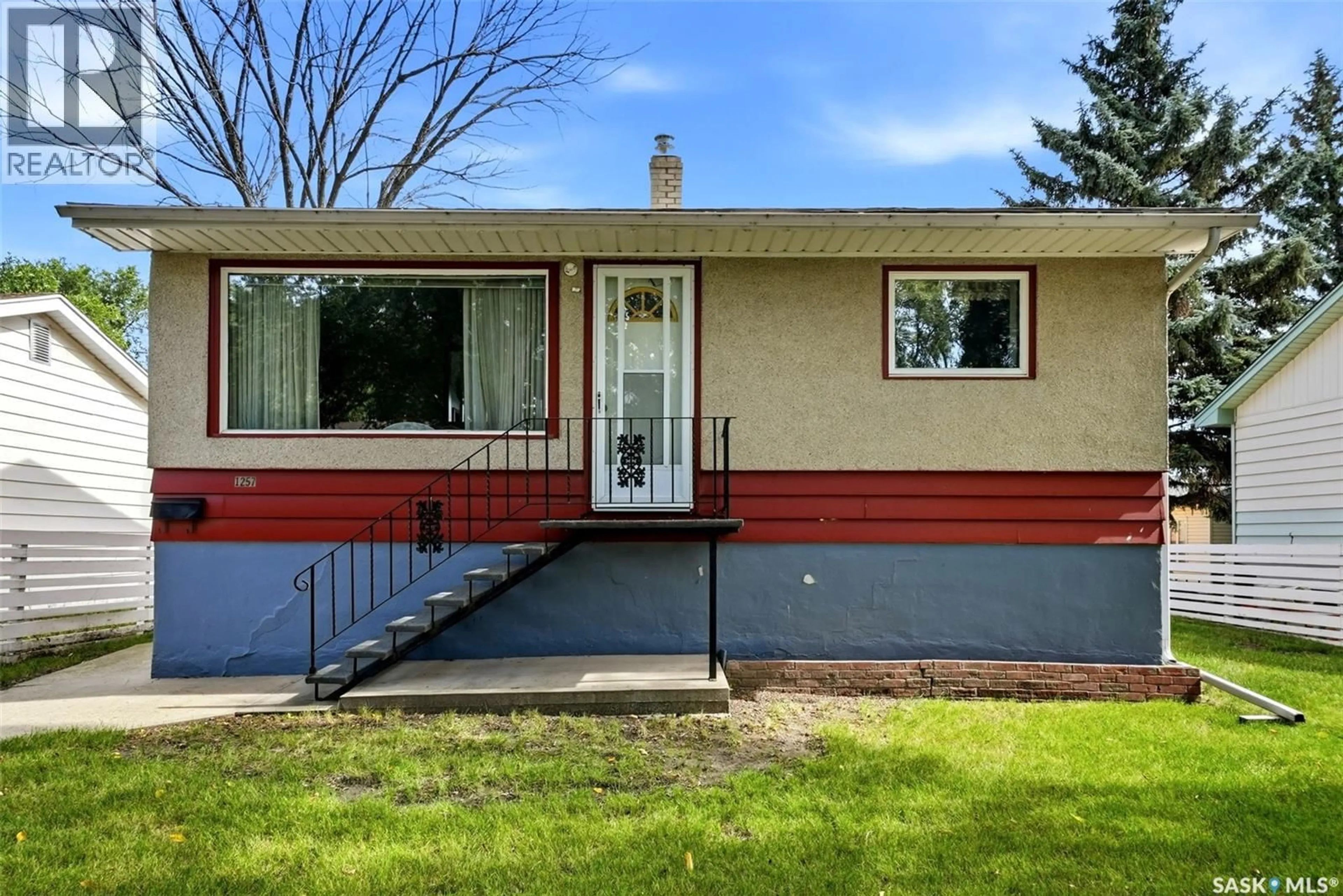 Home with vinyl exterior material, street for 1257 LINDSAY STREET, Regina Saskatchewan S4N3B4