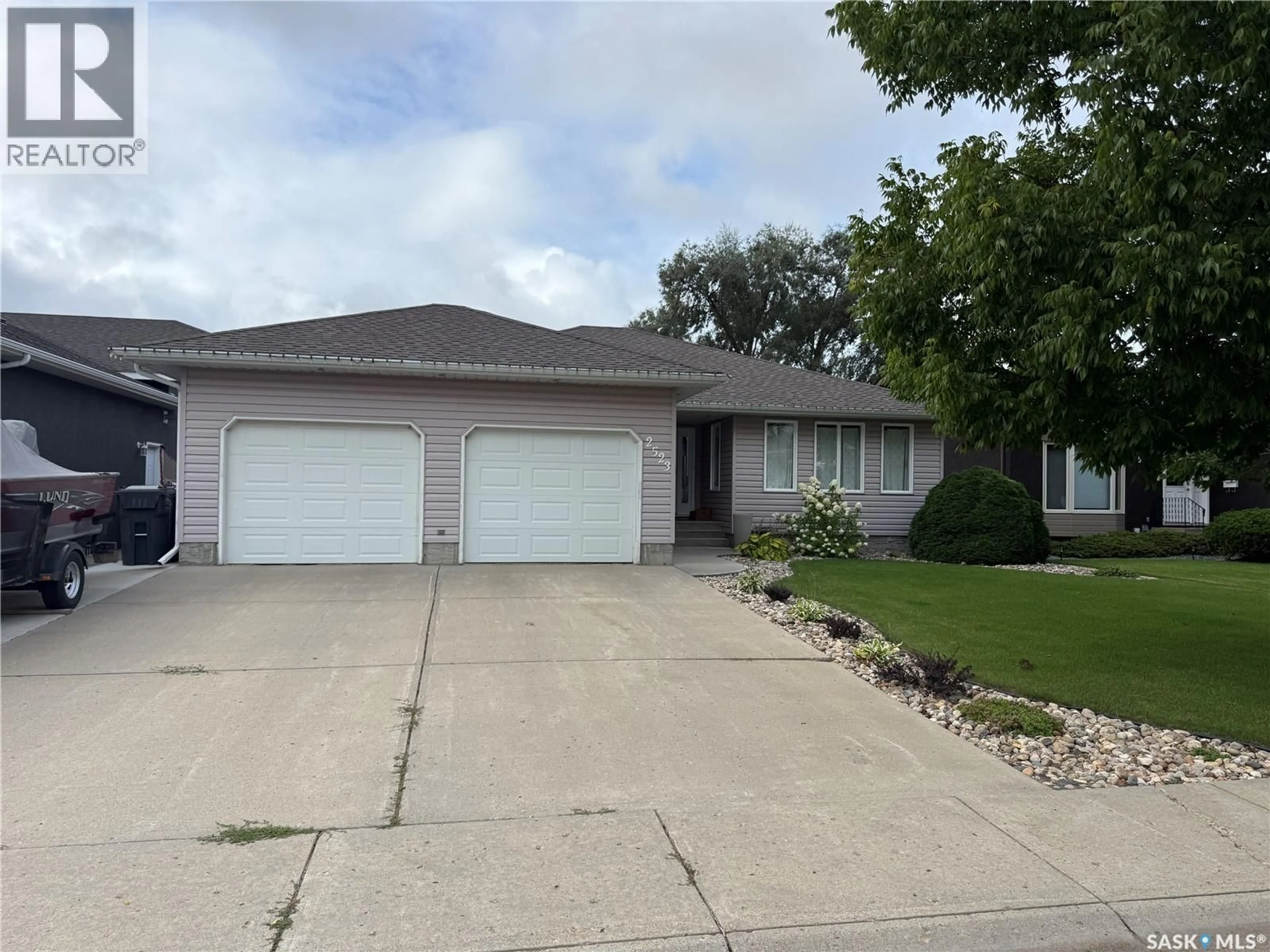Home with vinyl exterior material, street for 2523 BLUE JAY CRESCENT, North Battleford Saskatchewan S9A3Z3