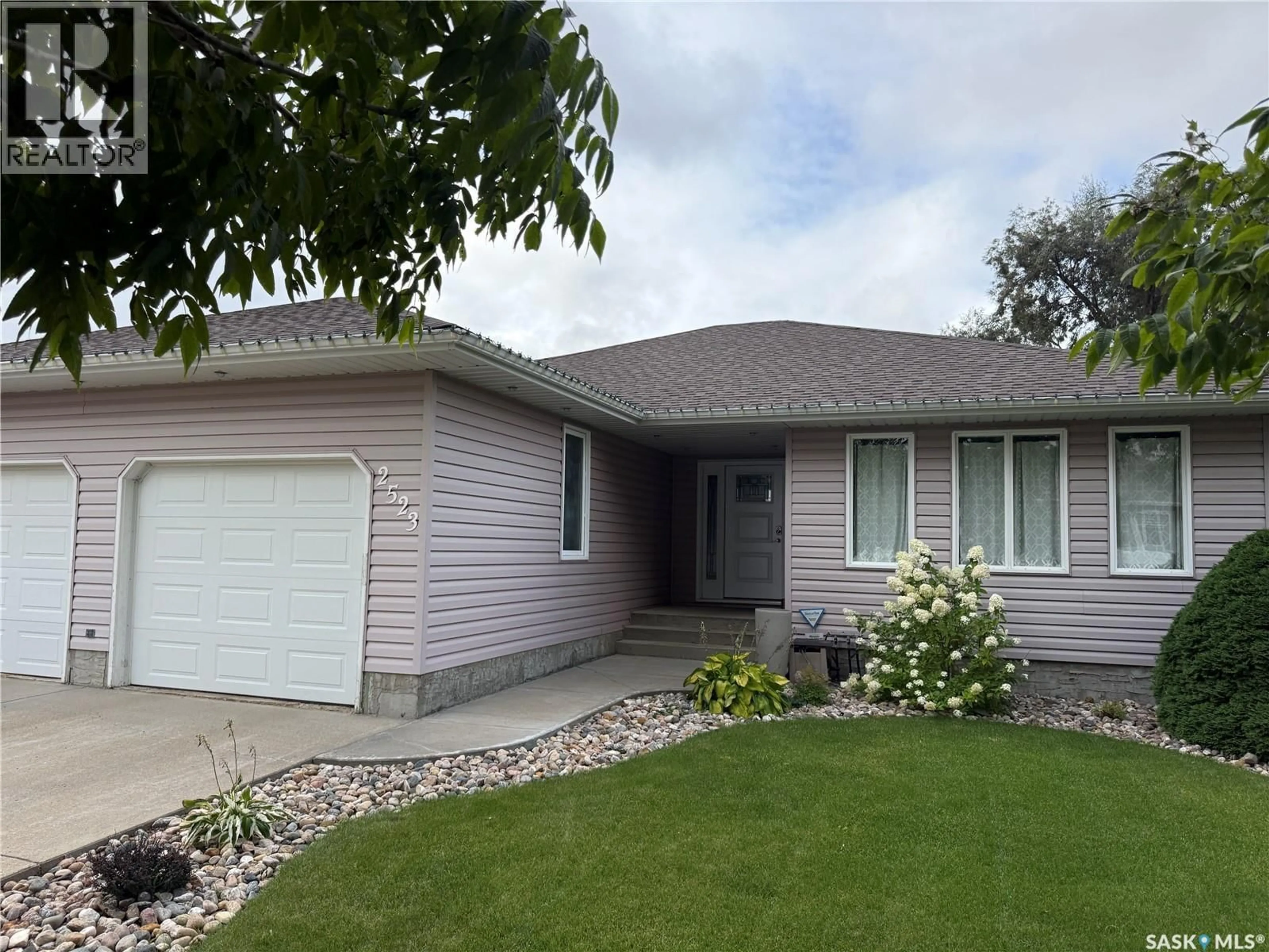 Home with vinyl exterior material, street for 2523 BLUE JAY CRESCENT, North Battleford Saskatchewan S9A3Z3