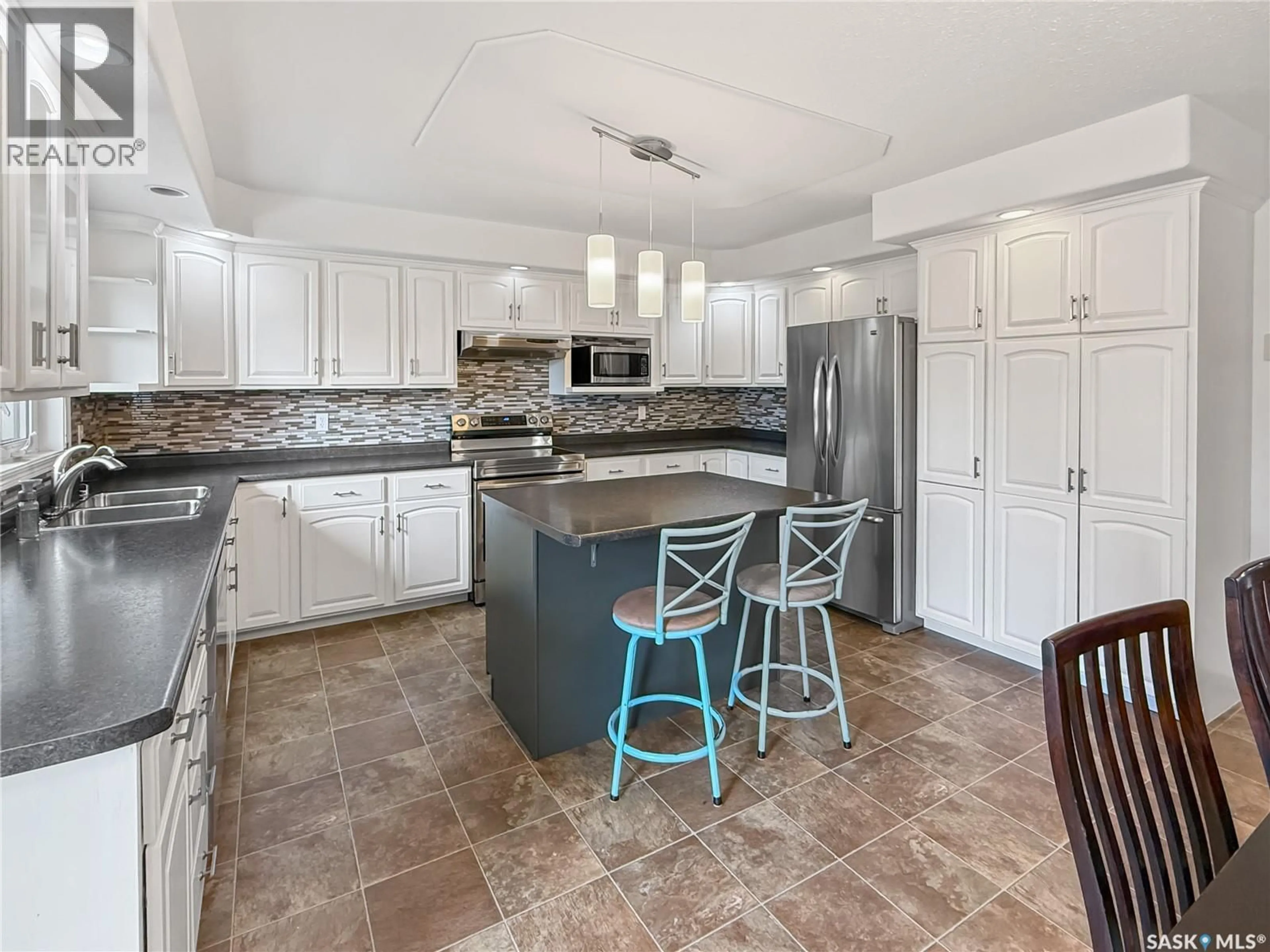 Open concept kitchen, ceramic/tile floor for 2523 BLUE JAY CRESCENT, North Battleford Saskatchewan S9A3Z3