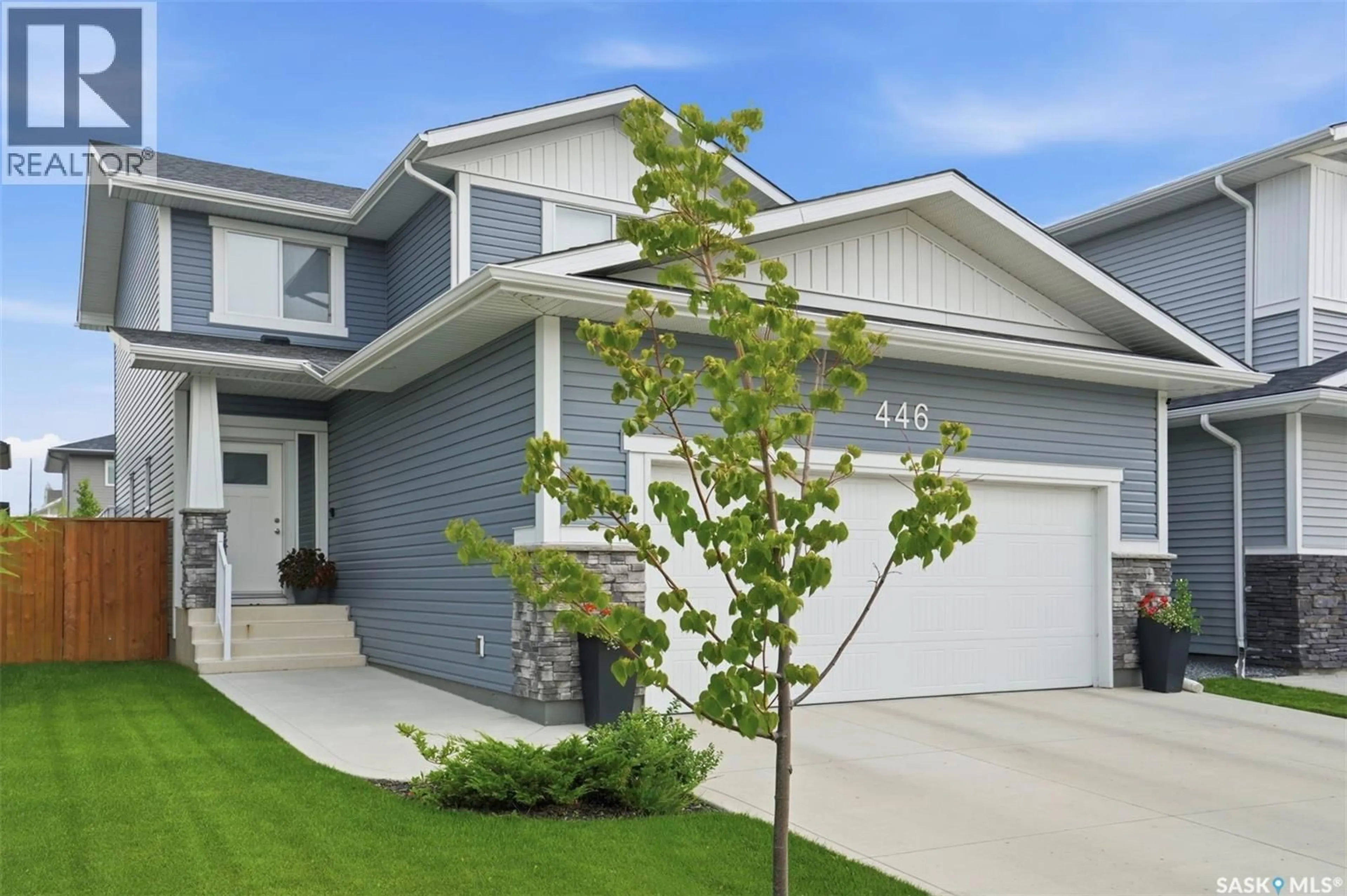 Home with vinyl exterior material, street for 446 GERMAIN MANOR, Saskatoon Saskatchewan S7V0T8