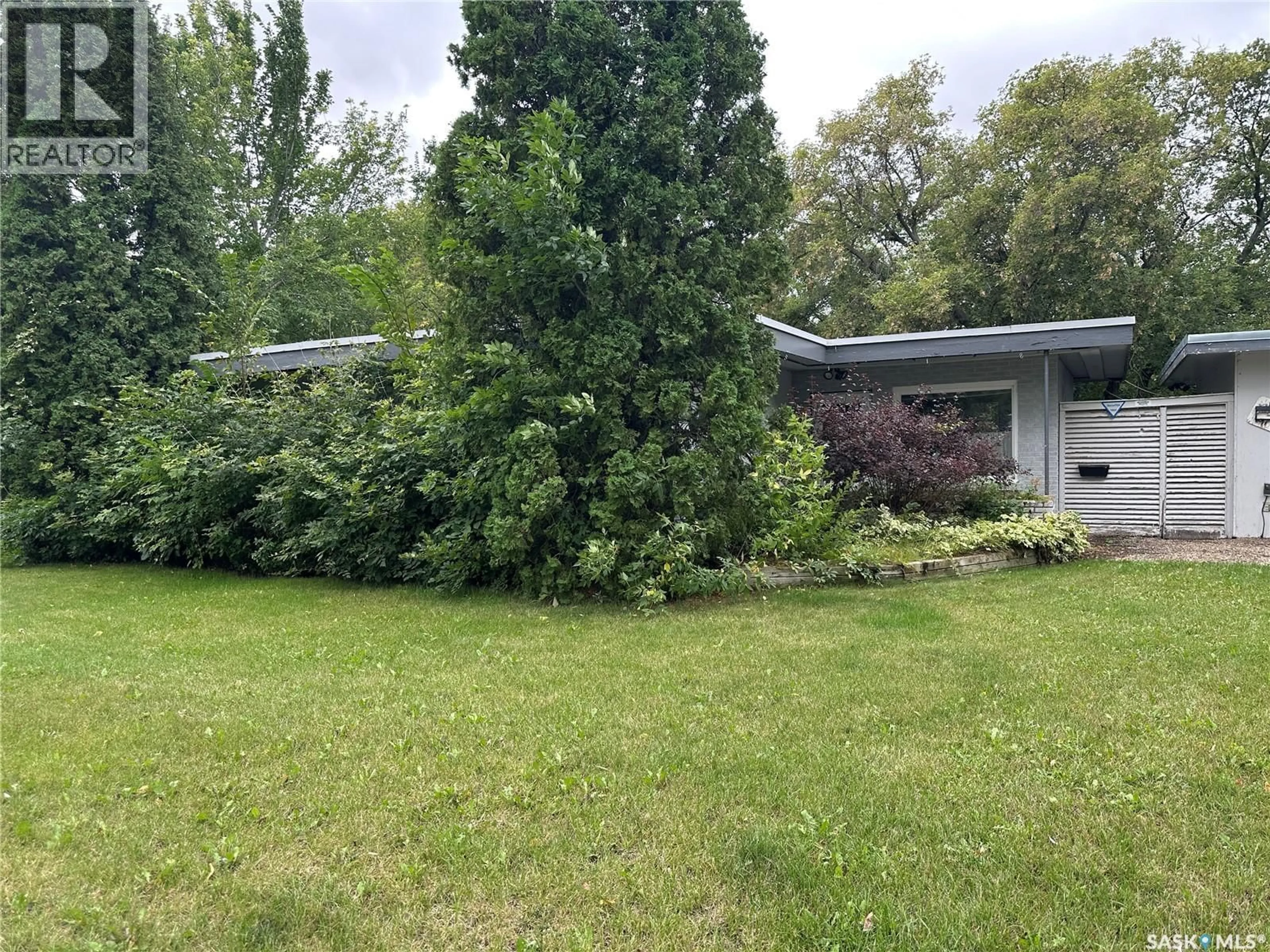 A pic from outside/outdoor area/front of a property/back of a property/a pic from drone, forest/trees view for 515 9TH STREET, Weyburn Saskatchewan S4H1G2