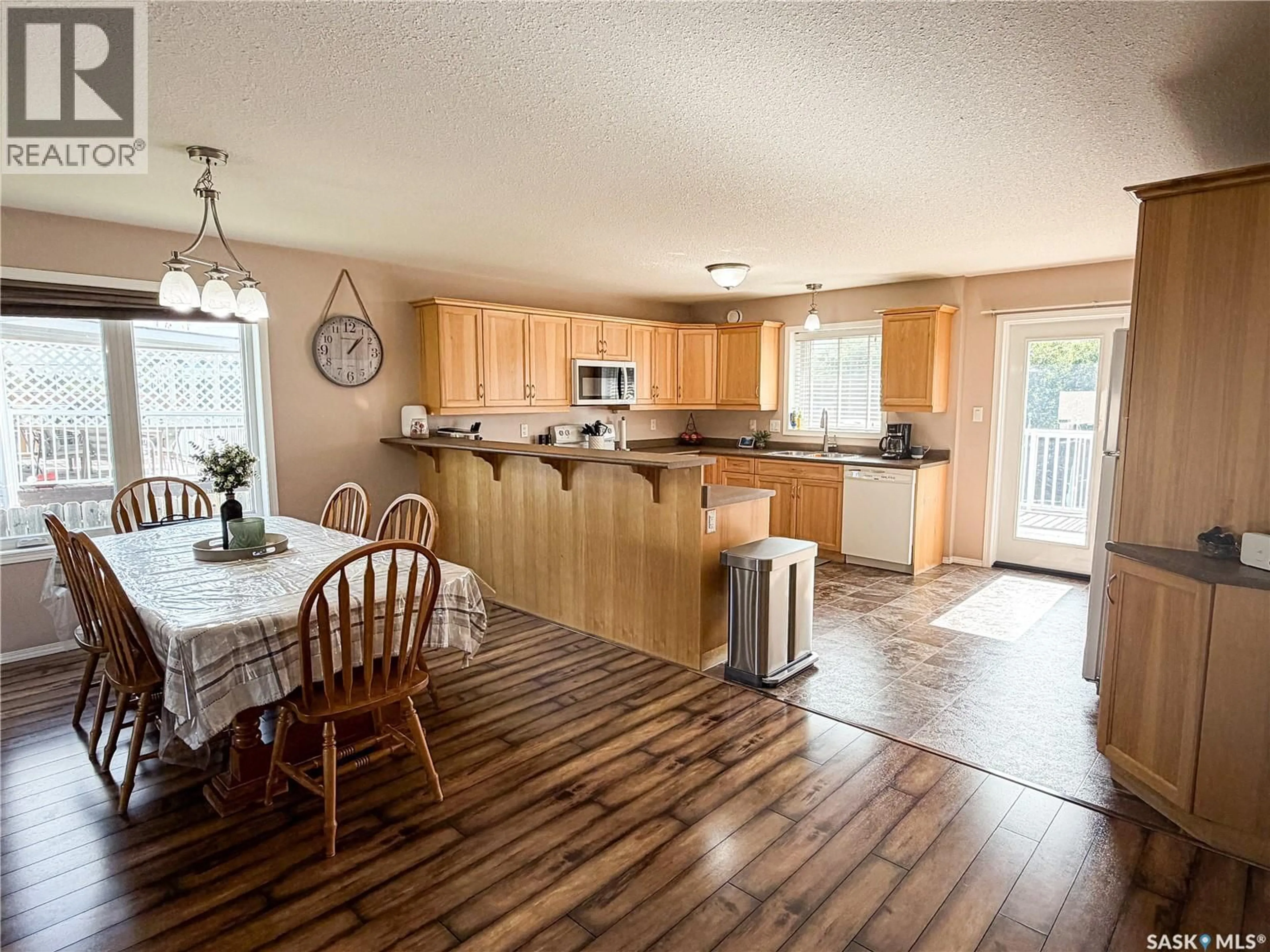 Open concept kitchen, wood/laminate floor for 604 7TH AVENUE, Meadow Lake Saskatchewan S9X1B1