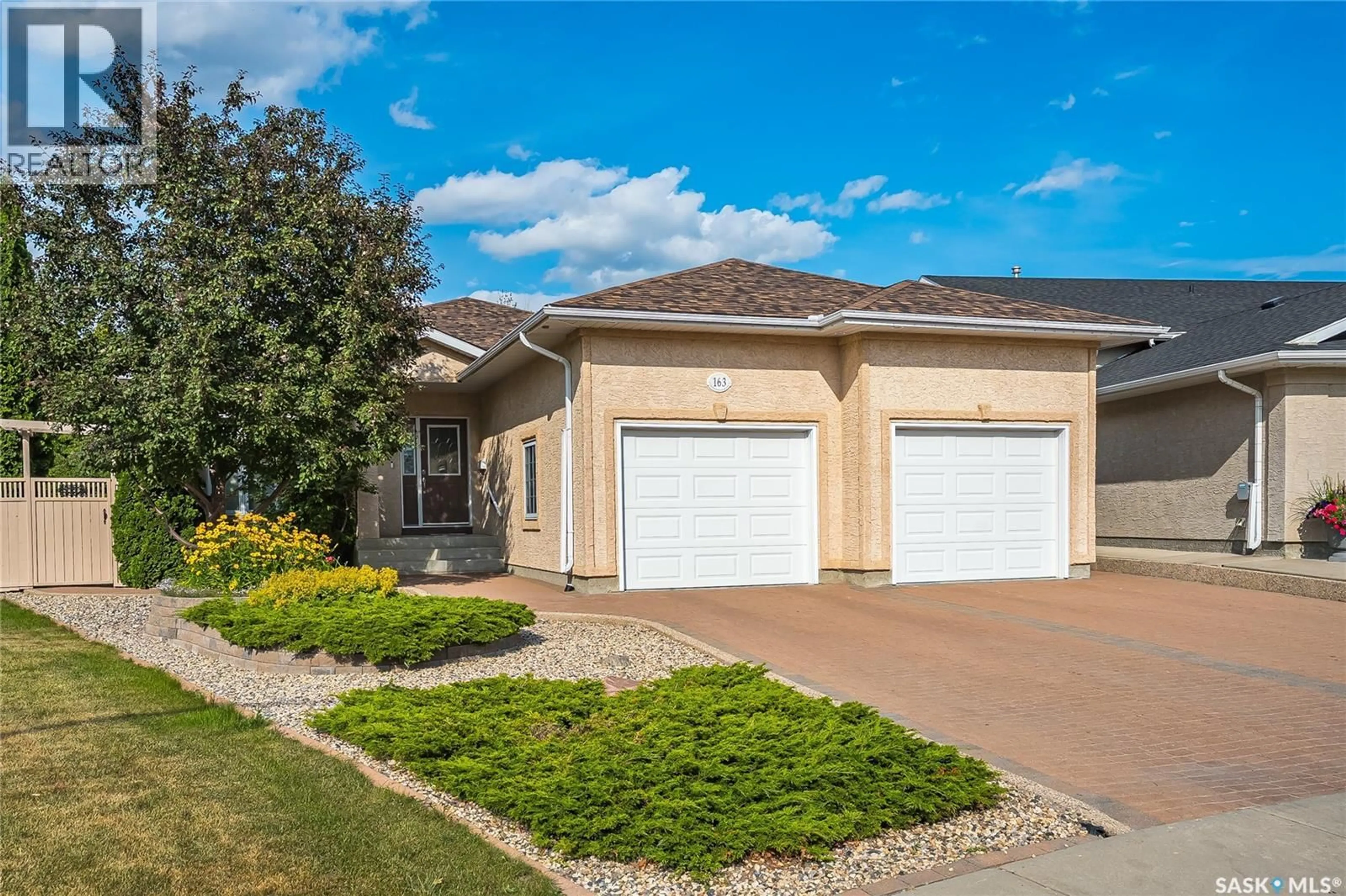 Home with vinyl exterior material, street for 163 BLACKBURN CRESCENT, Saskatoon Saskatchewan S7V1E7