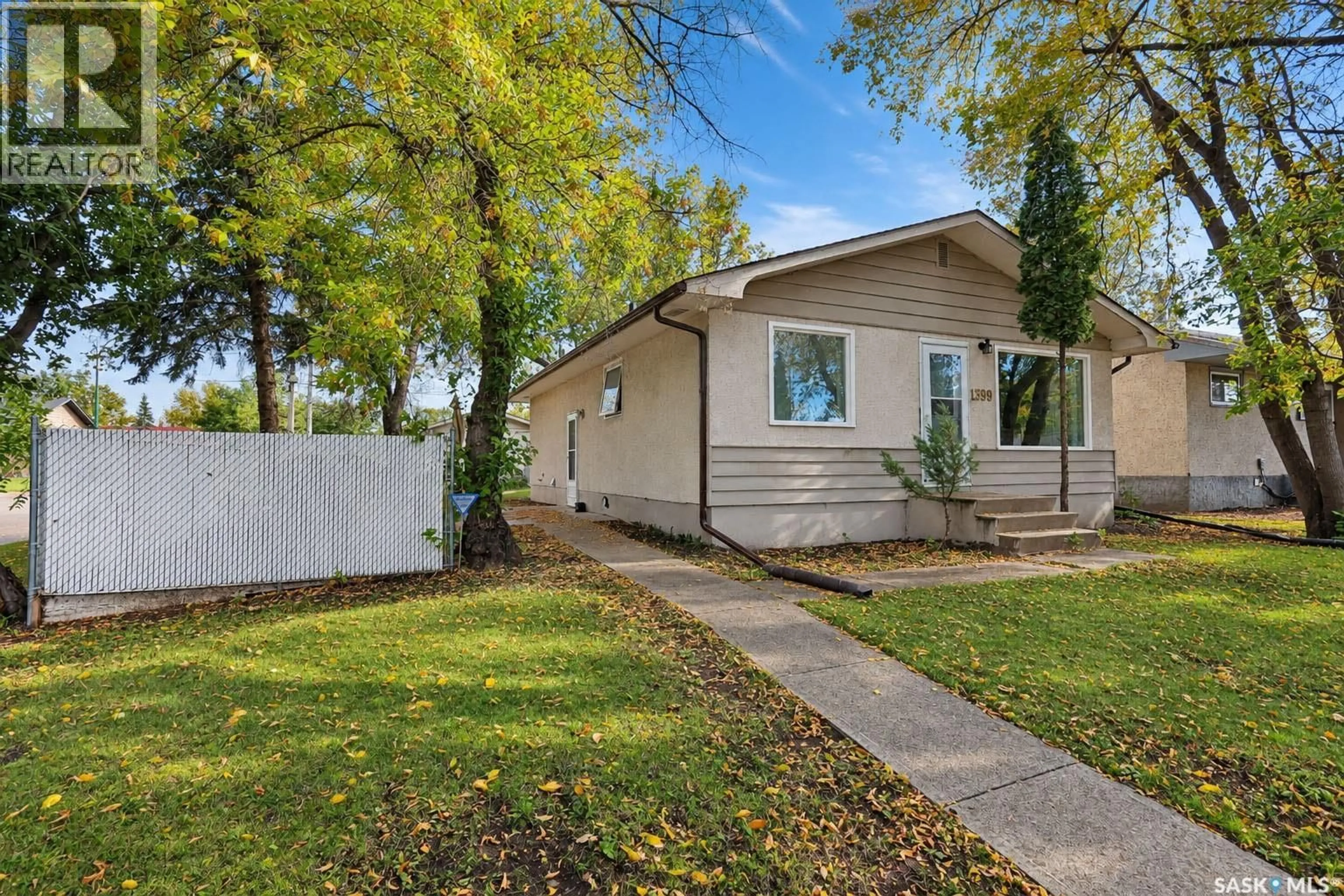 Home with vinyl exterior material, street for 1399 6TH STREET, Prince Albert Saskatchewan S6V0R1
