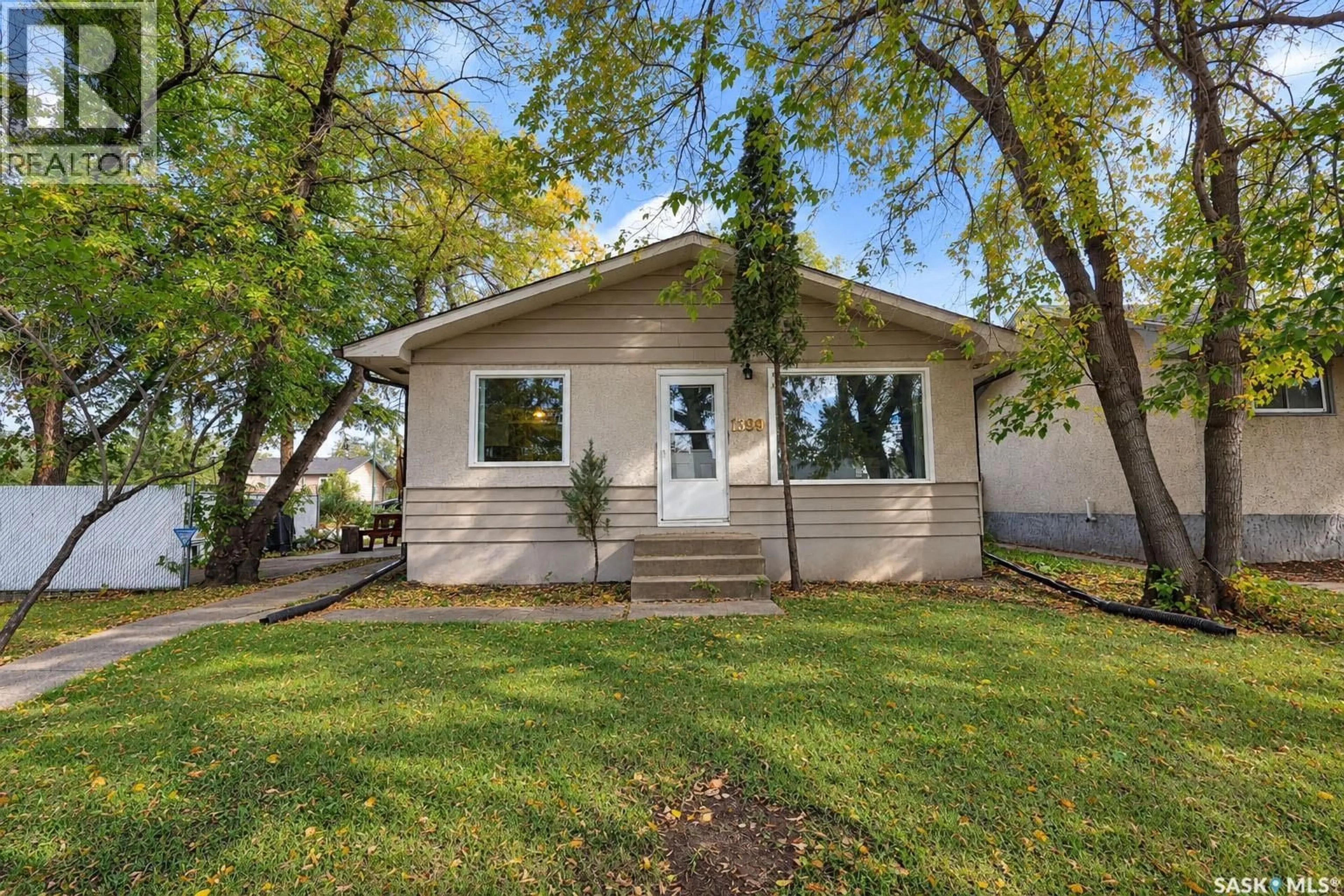 Home with vinyl exterior material, street for 1399 6TH STREET, Prince Albert Saskatchewan S6V0R1
