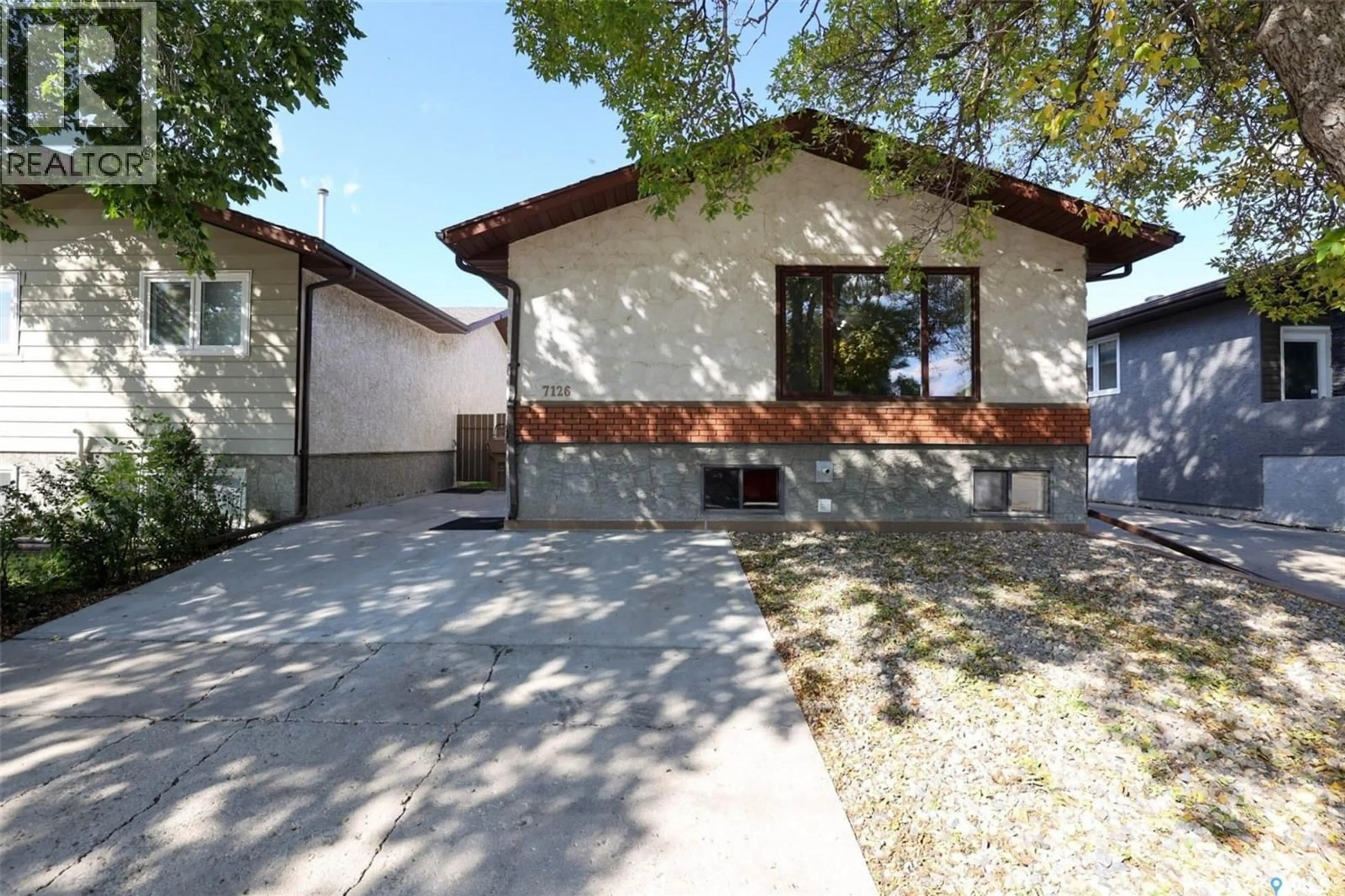 Home with brick exterior material, street for 7126 DALGLIESH DRIVE, Regina Saskatchewan S4X2M6