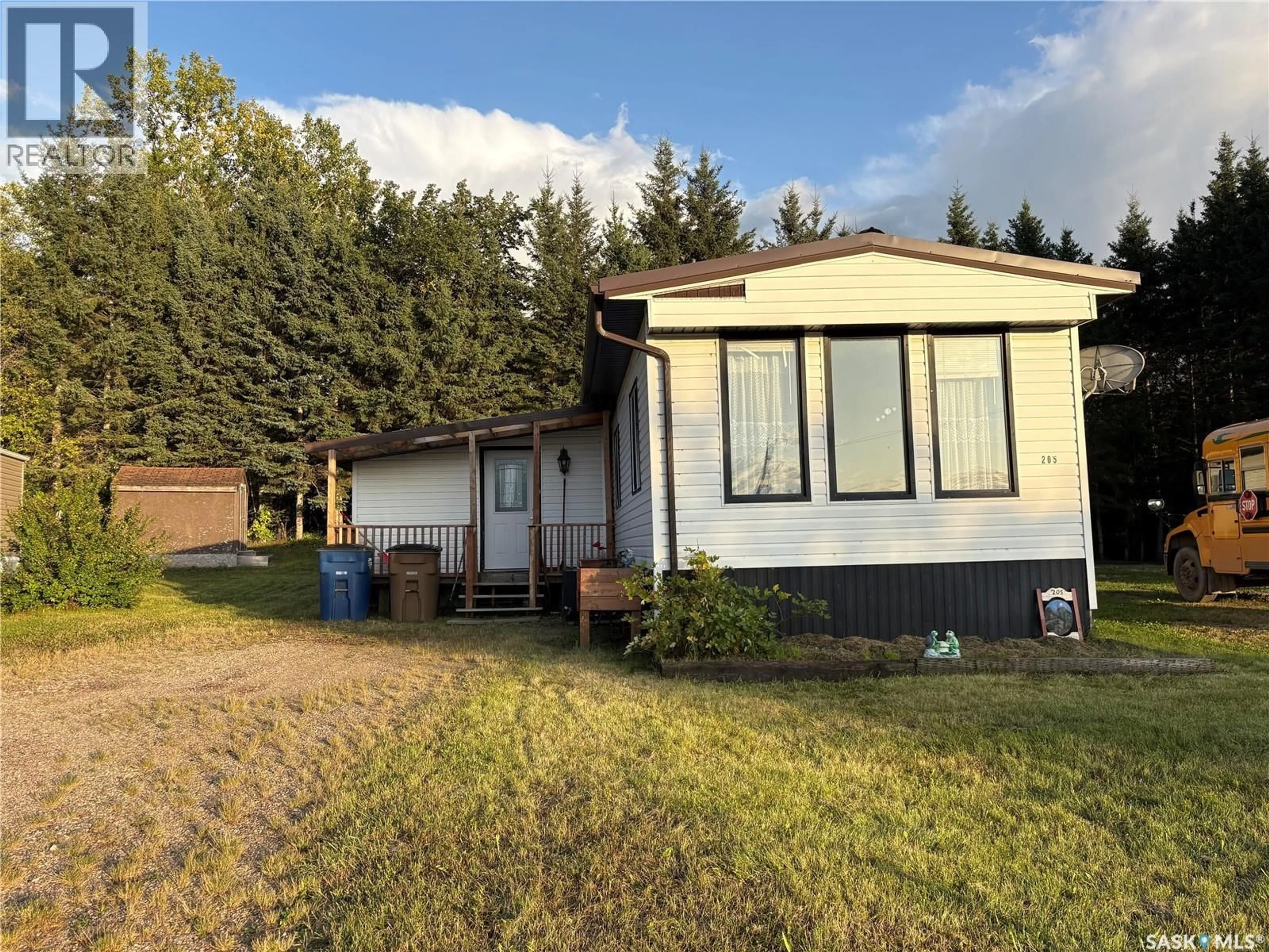 A pic from outside/outdoor area/front of a property/back of a property/a pic from drone, unknown for 205 SUNDBY CRESCENT, Big River Saskatchewan S0J0E0