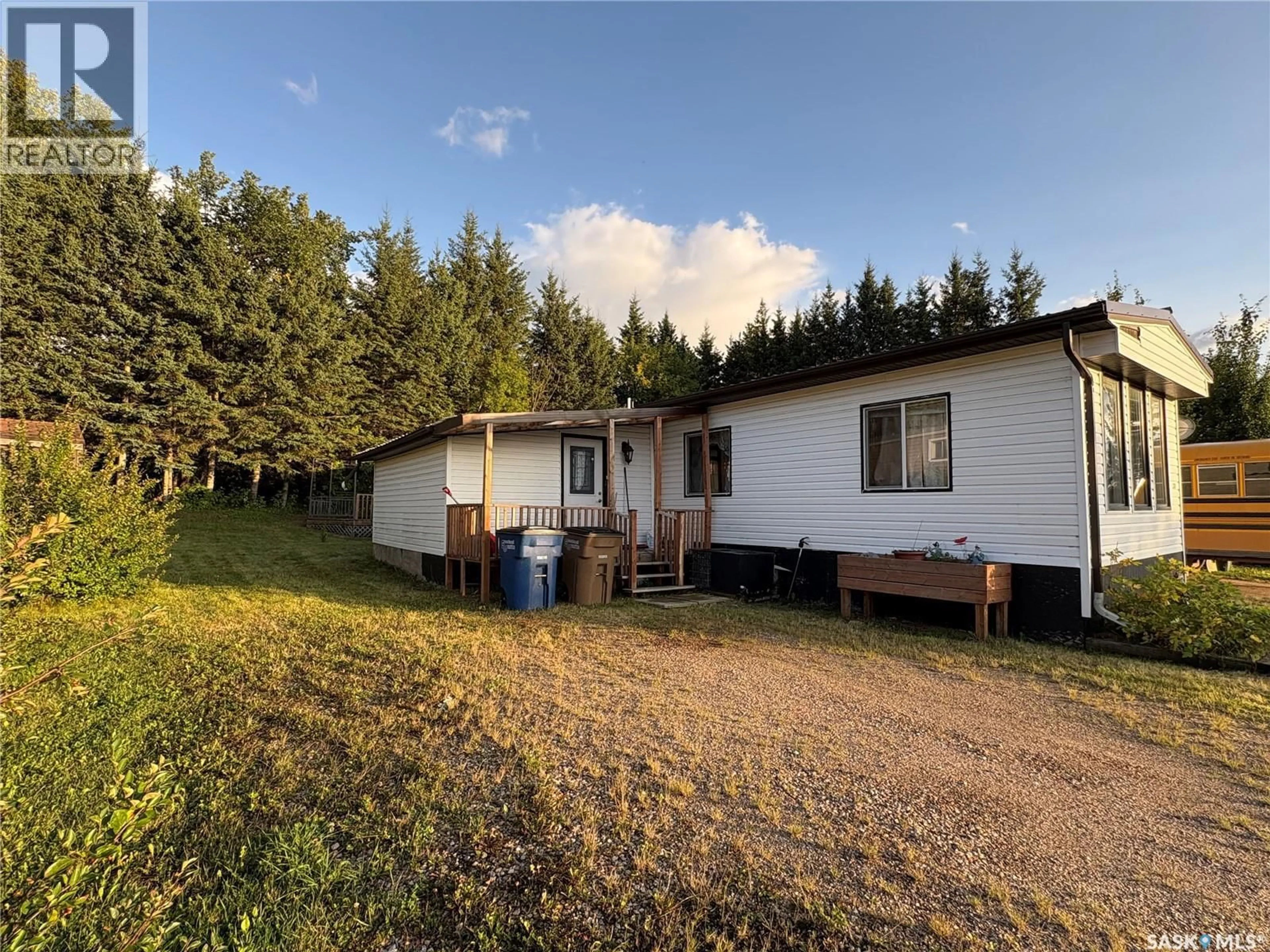 A pic from outside/outdoor area/front of a property/back of a property/a pic from drone, building for 205 SUNDBY CRESCENT, Big River Saskatchewan S0J0E0