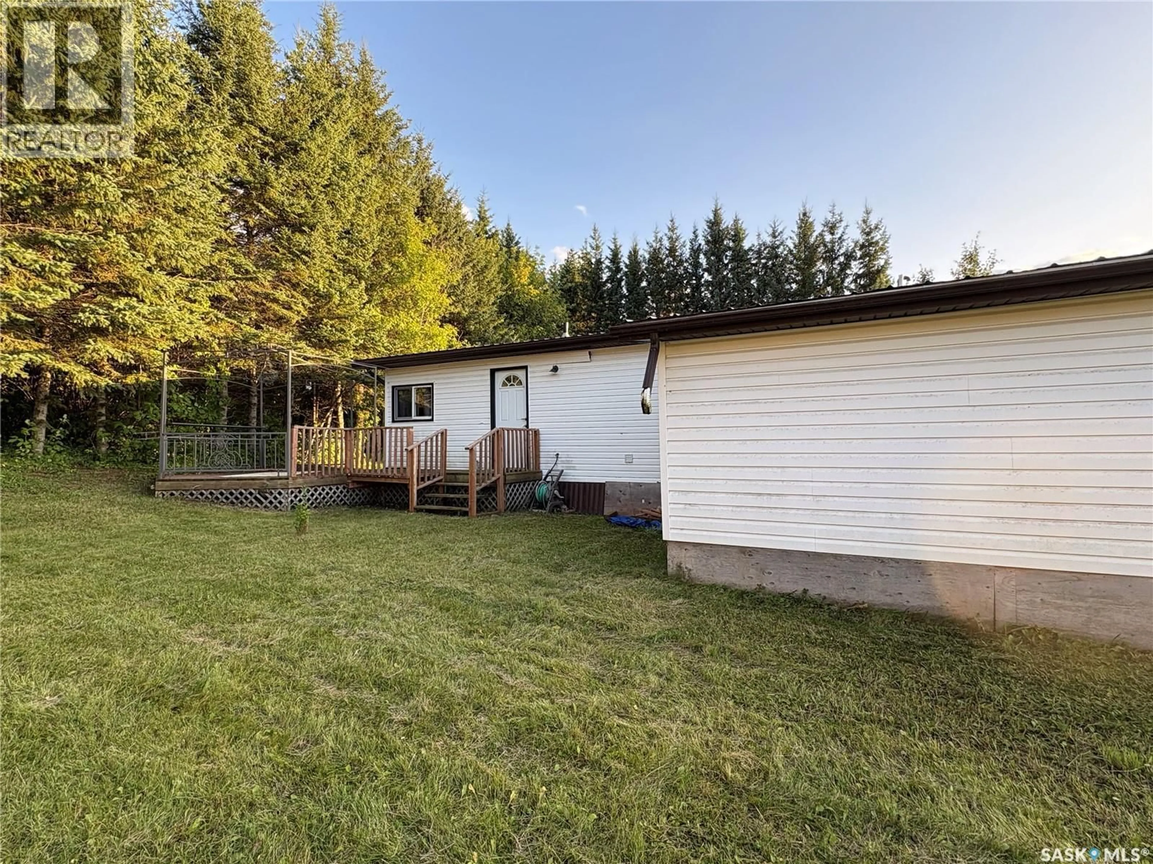 A pic from outside/outdoor area/front of a property/back of a property/a pic from drone, unknown for 205 SUNDBY CRESCENT, Big River Saskatchewan S0J0E0