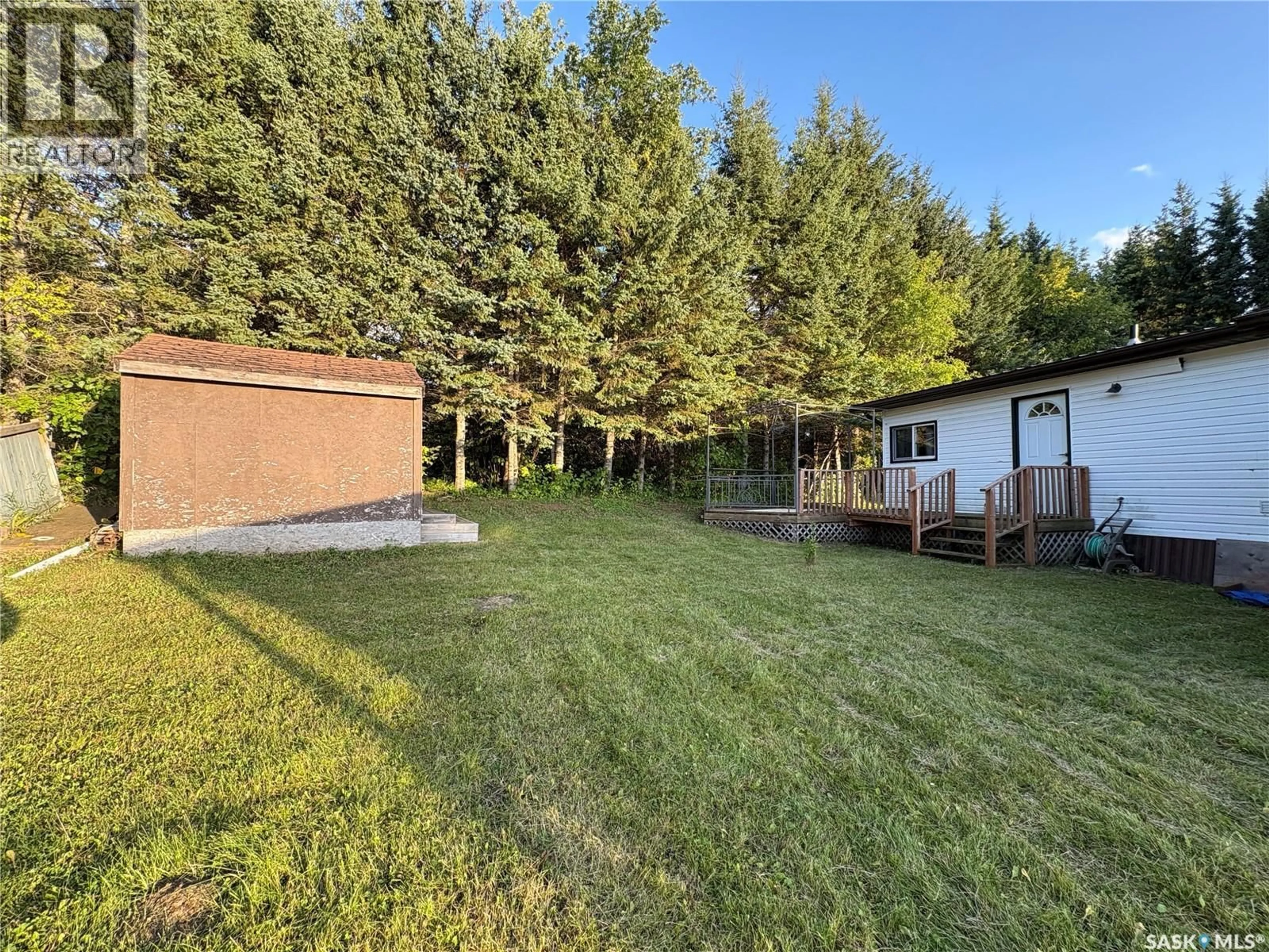 A pic from outside/outdoor area/front of a property/back of a property/a pic from drone, forest/trees view for 205 SUNDBY CRESCENT, Big River Saskatchewan S0J0E0