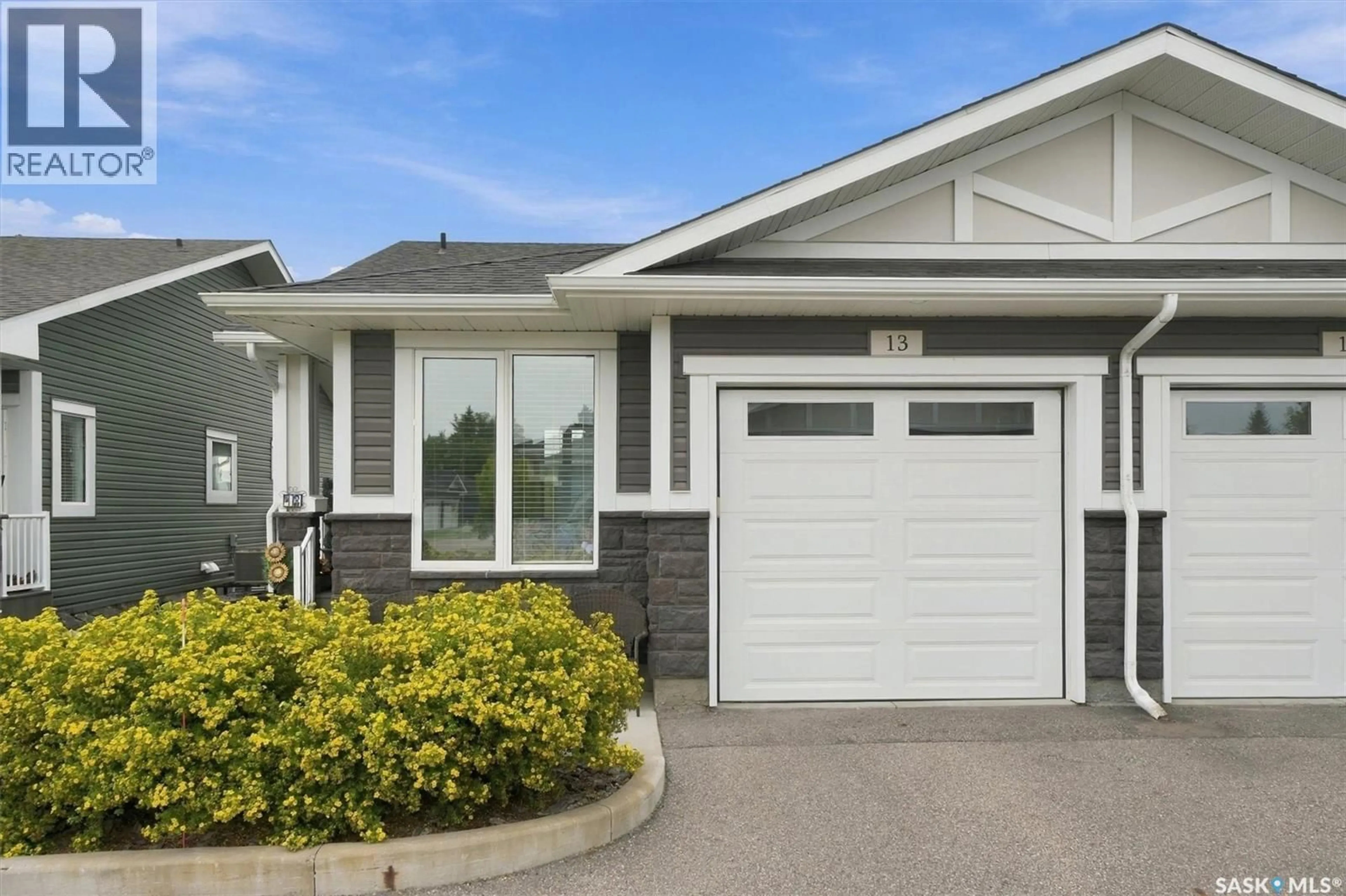 Home with vinyl exterior material, street for 13 - 3214 11TH STREET, Saskatoon Saskatchewan S7M5G3