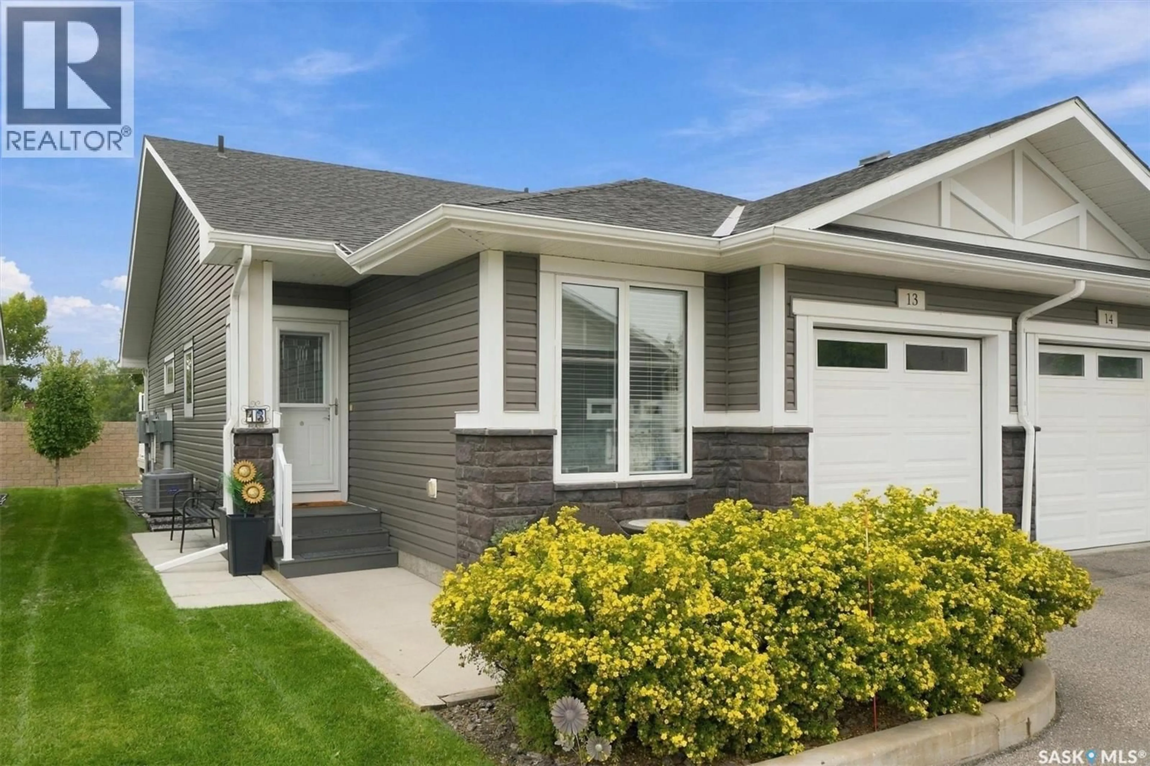 Home with vinyl exterior material, street for 13 - 3214 11TH STREET, Saskatoon Saskatchewan S7M5G3