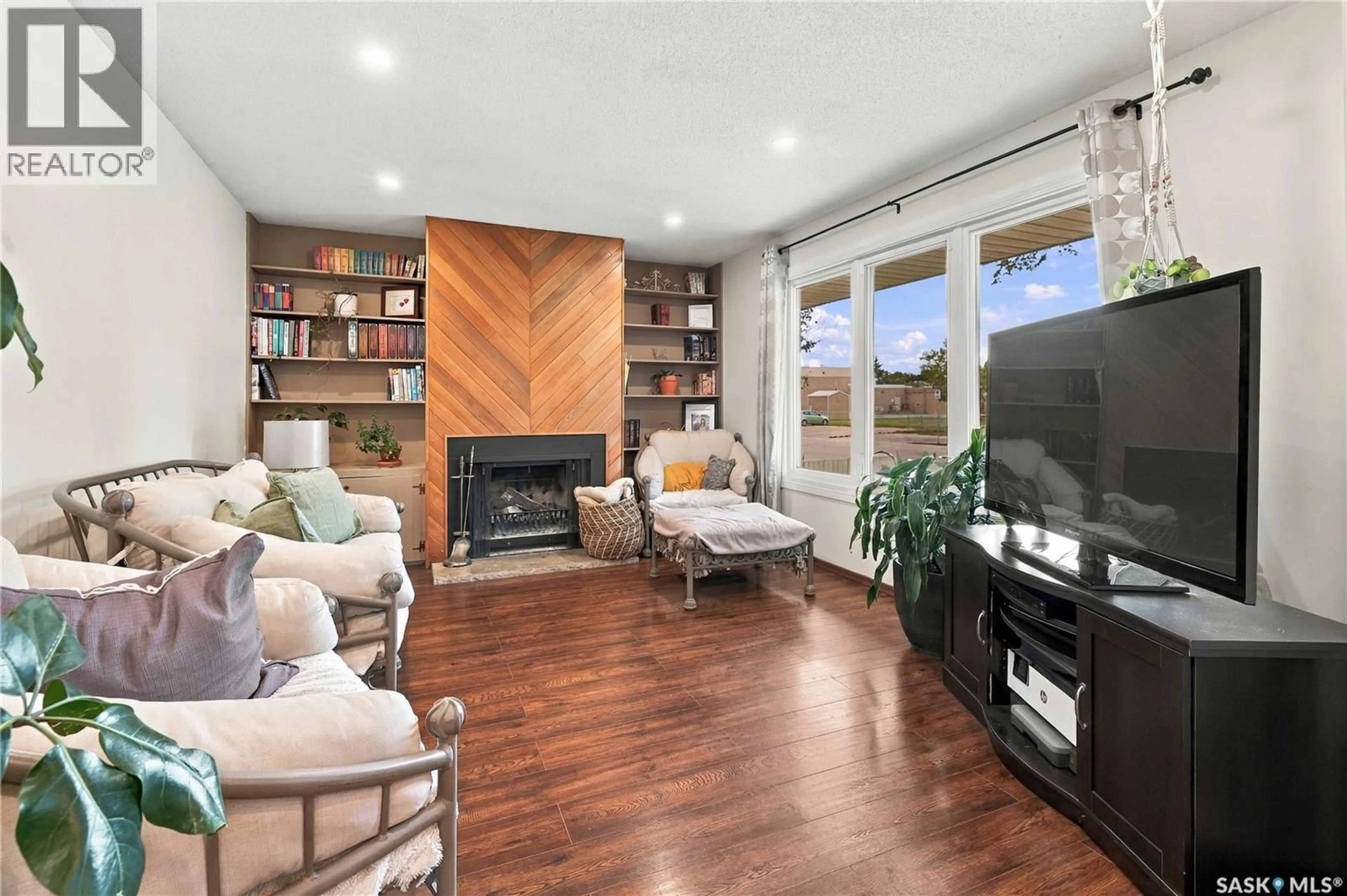 Living room with furniture, wood/laminate floor for 195 WELLS STREET, Regina Saskatchewan S4R5Z6
