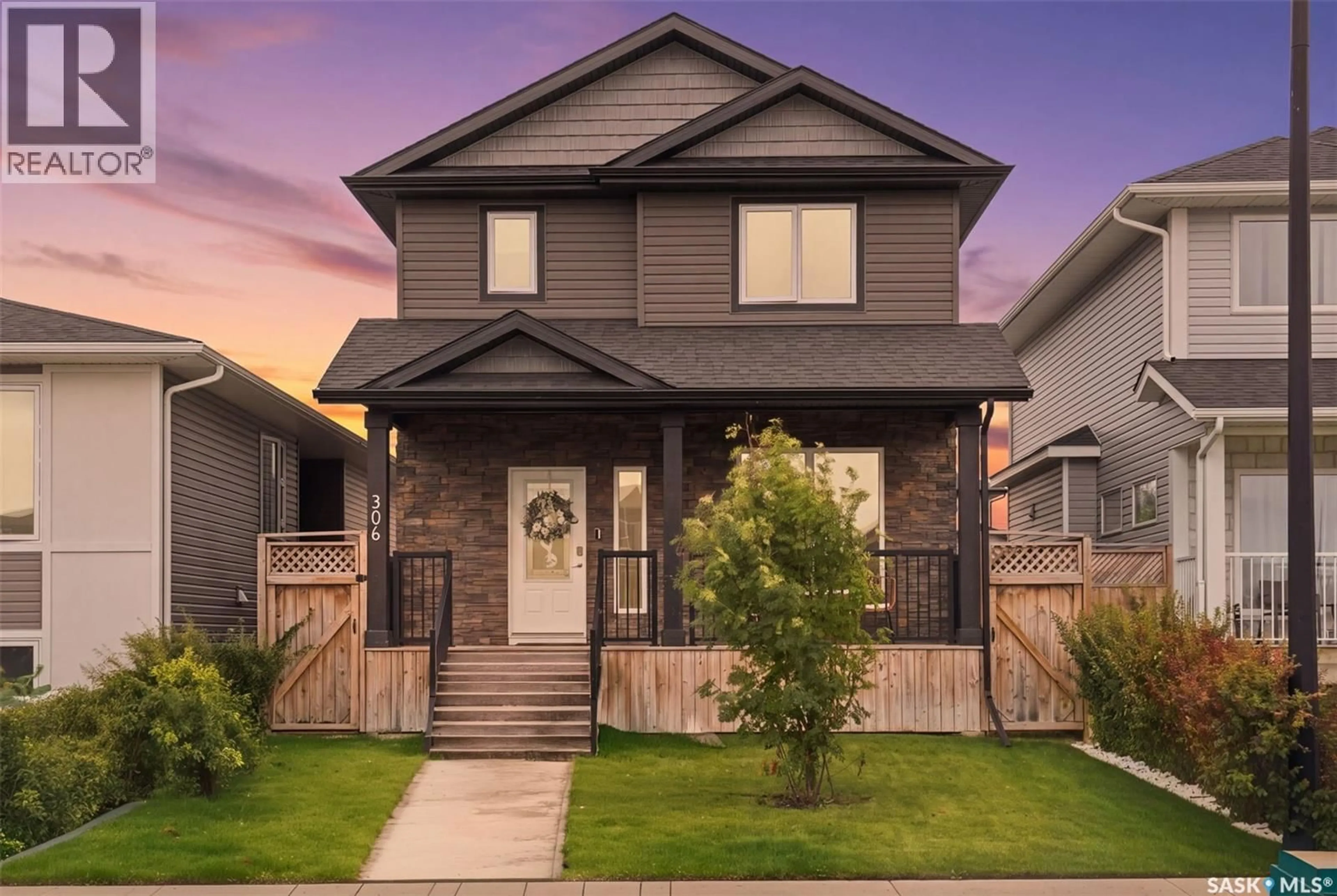 Home with vinyl exterior material, street for 306 BENTLEY LANE, Saskatoon Saskatchewan S7L6L3