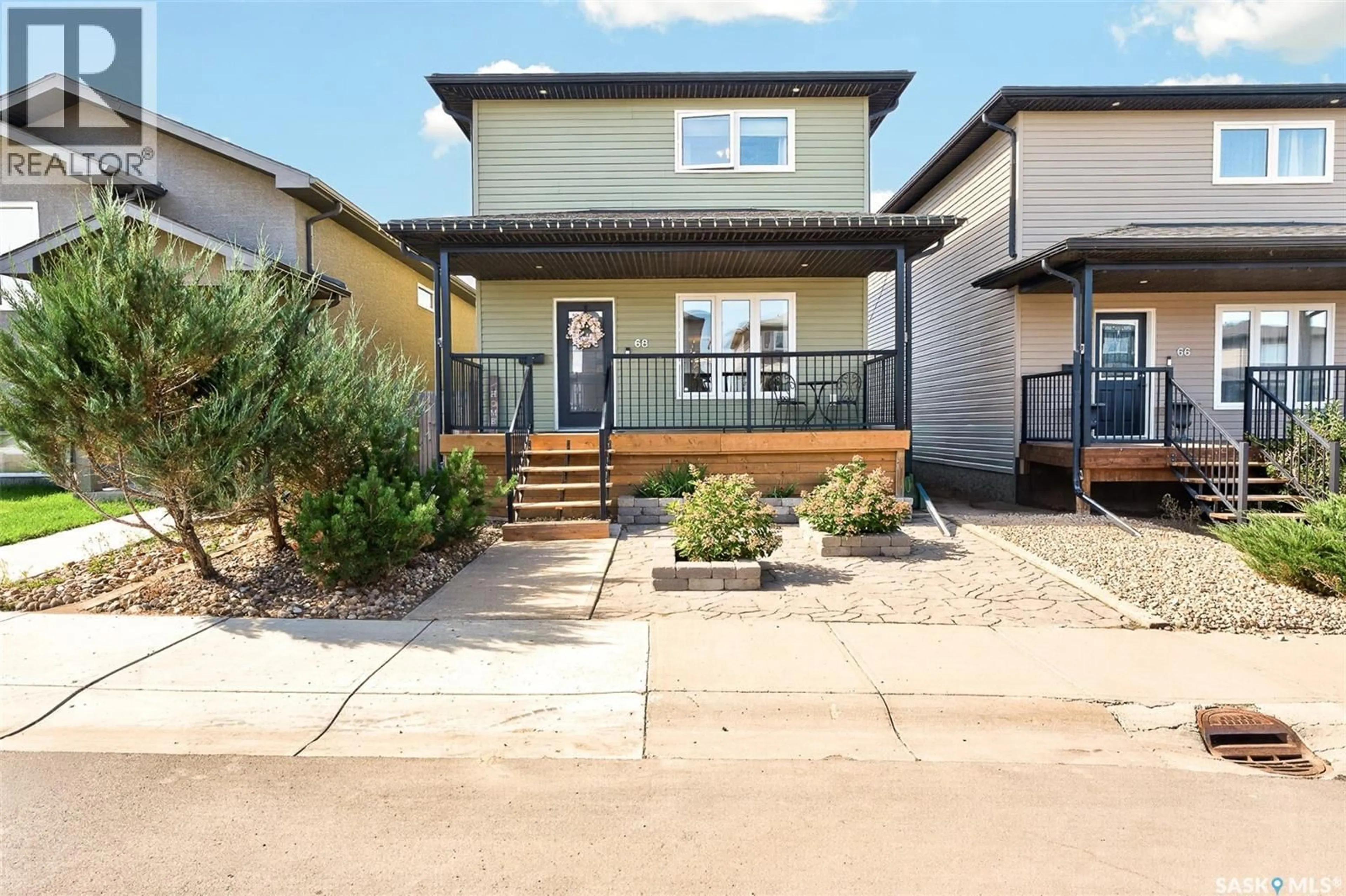 Home with vinyl exterior material, street for 68 BRIGHAM ROAD, Moose Jaw Saskatchewan S6K0A7