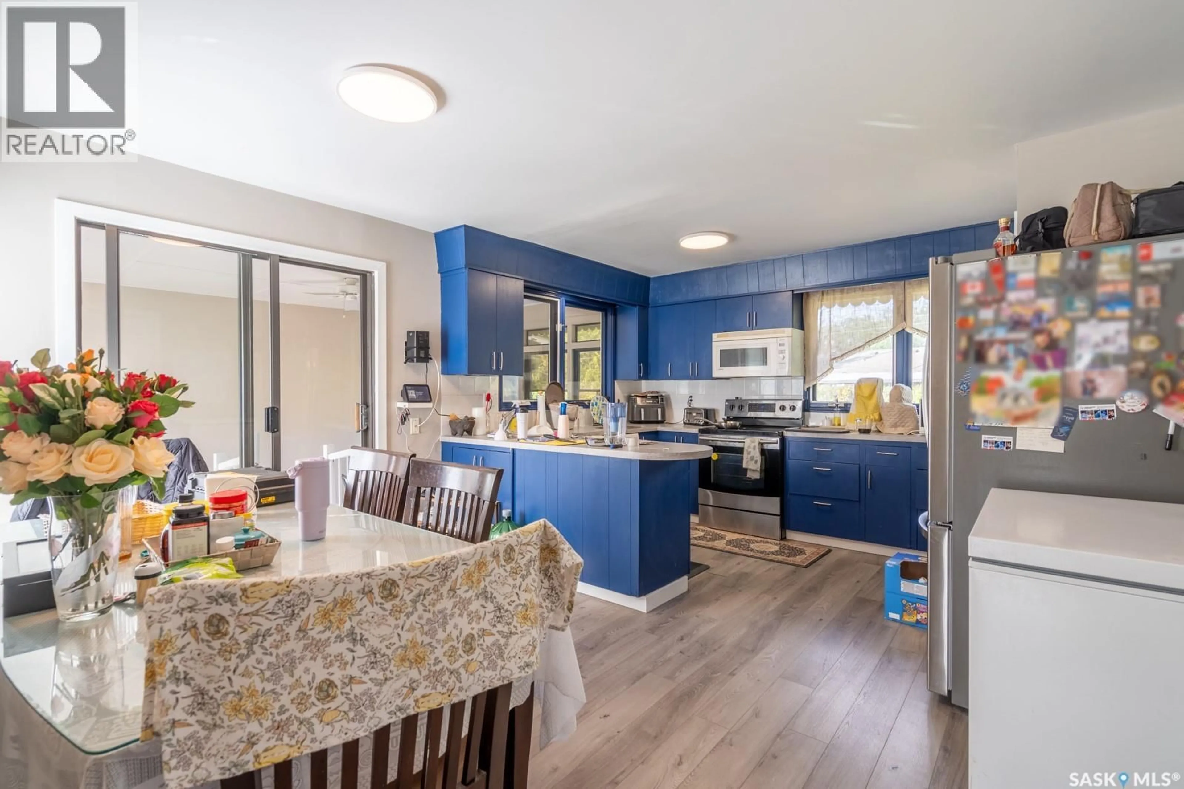 Open concept kitchen, wood/laminate floor for 11 BRIARWOOD PLACE, Regina Saskatchewan S4S5M8
