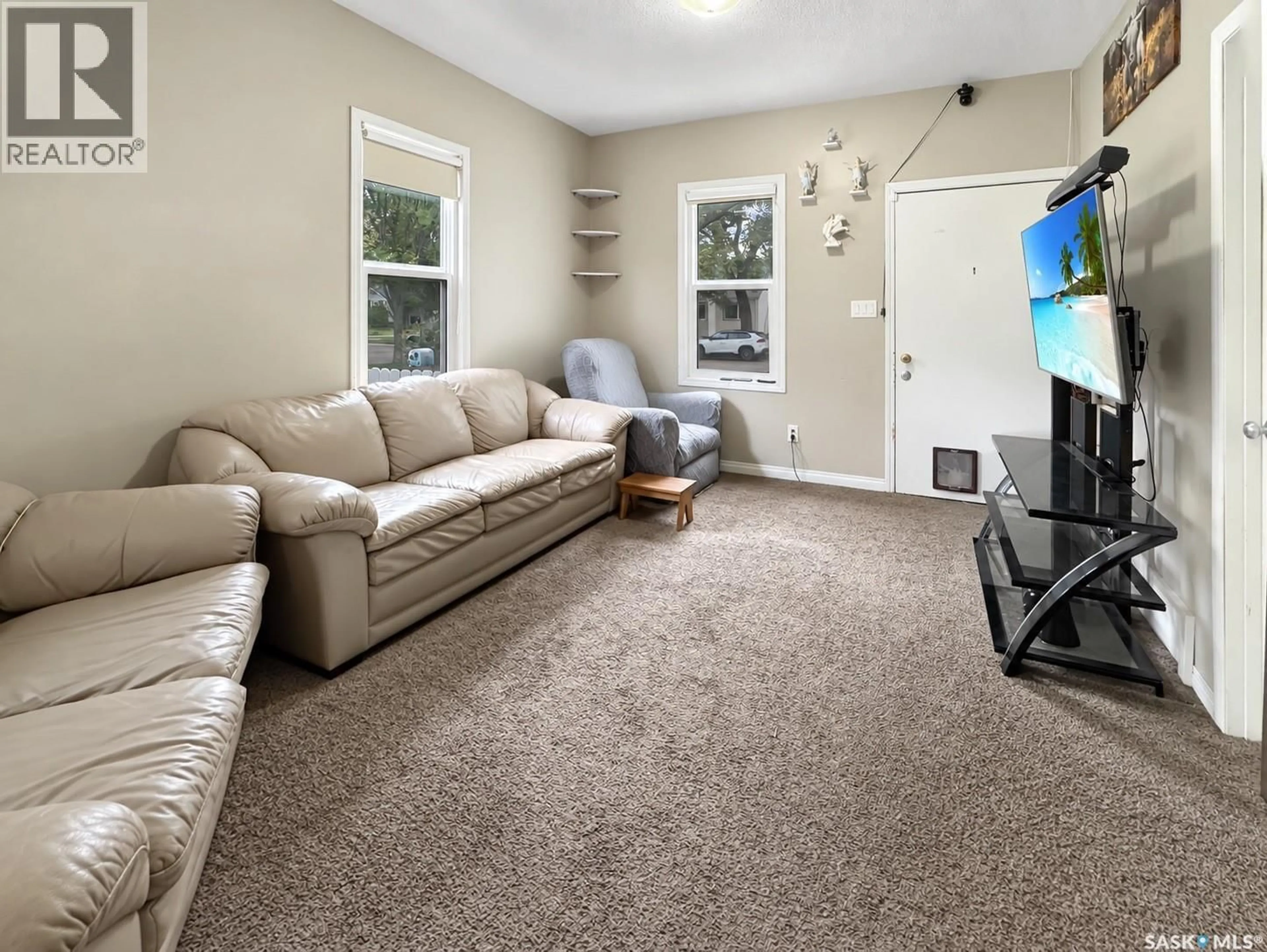 Living room with furniture, carpet floor for 1552 99TH STREET, North Battleford Saskatchewan S9A0R3