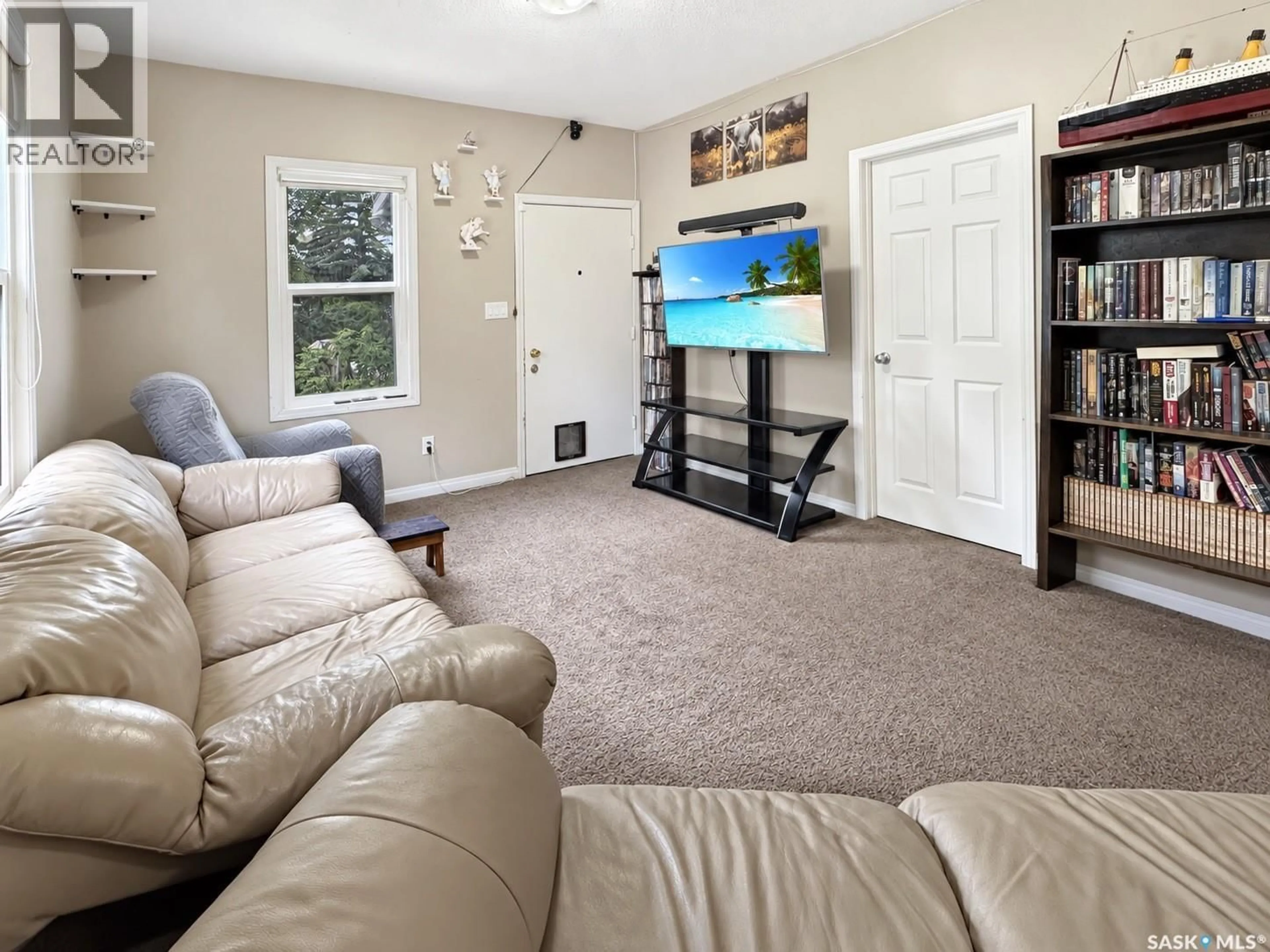 Living room with furniture, carpet floor for 1552 99TH STREET, North Battleford Saskatchewan S9A0R3