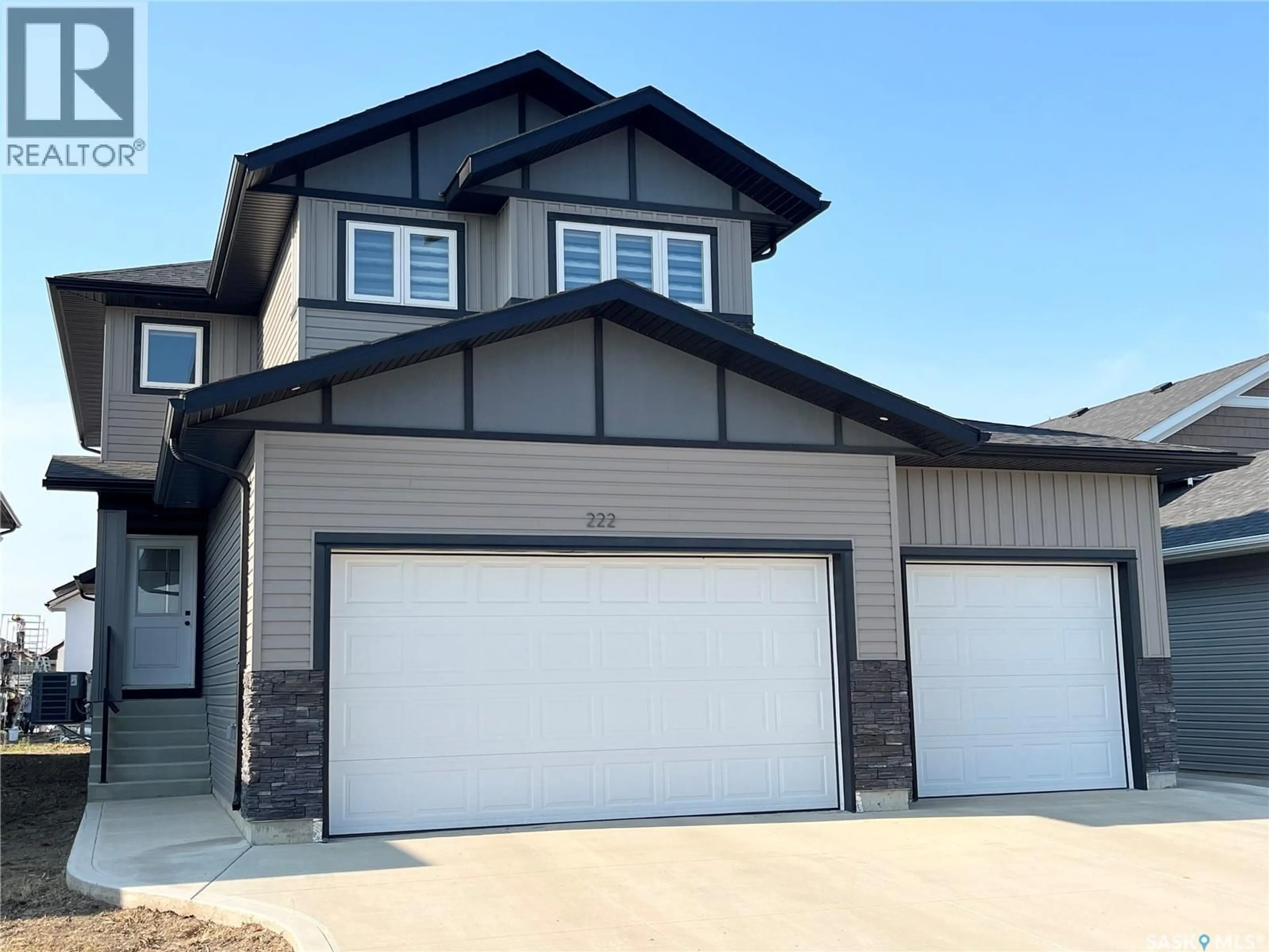 Home with vinyl exterior material, street for 222 NIGHTINGALE ROAD, Saskatoon Saskatchewan S7L6Y1