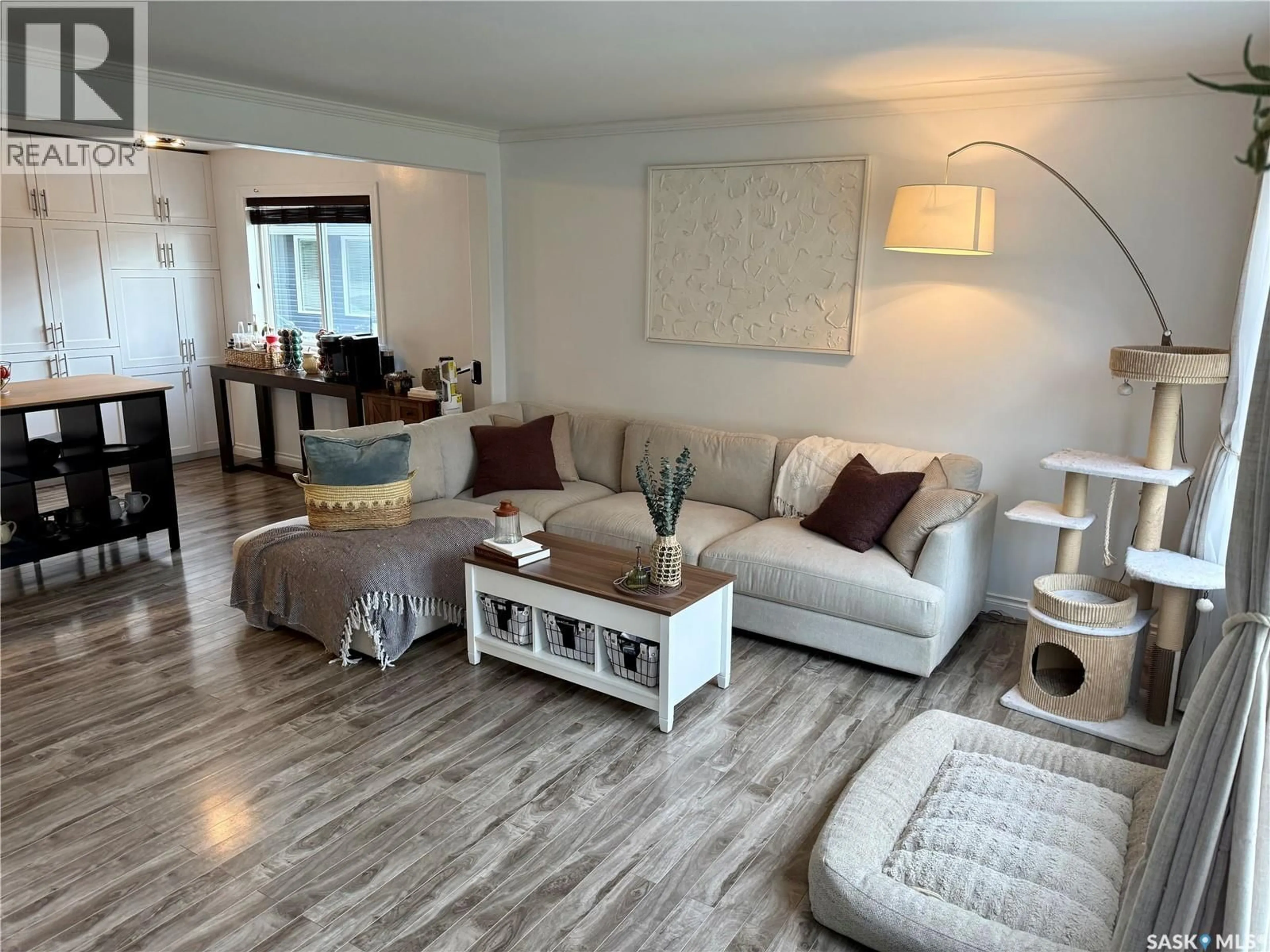 Living room with furniture, wood/laminate floor for E - 105 5TH STREET, Nipawin Saskatchewan S0E1E0