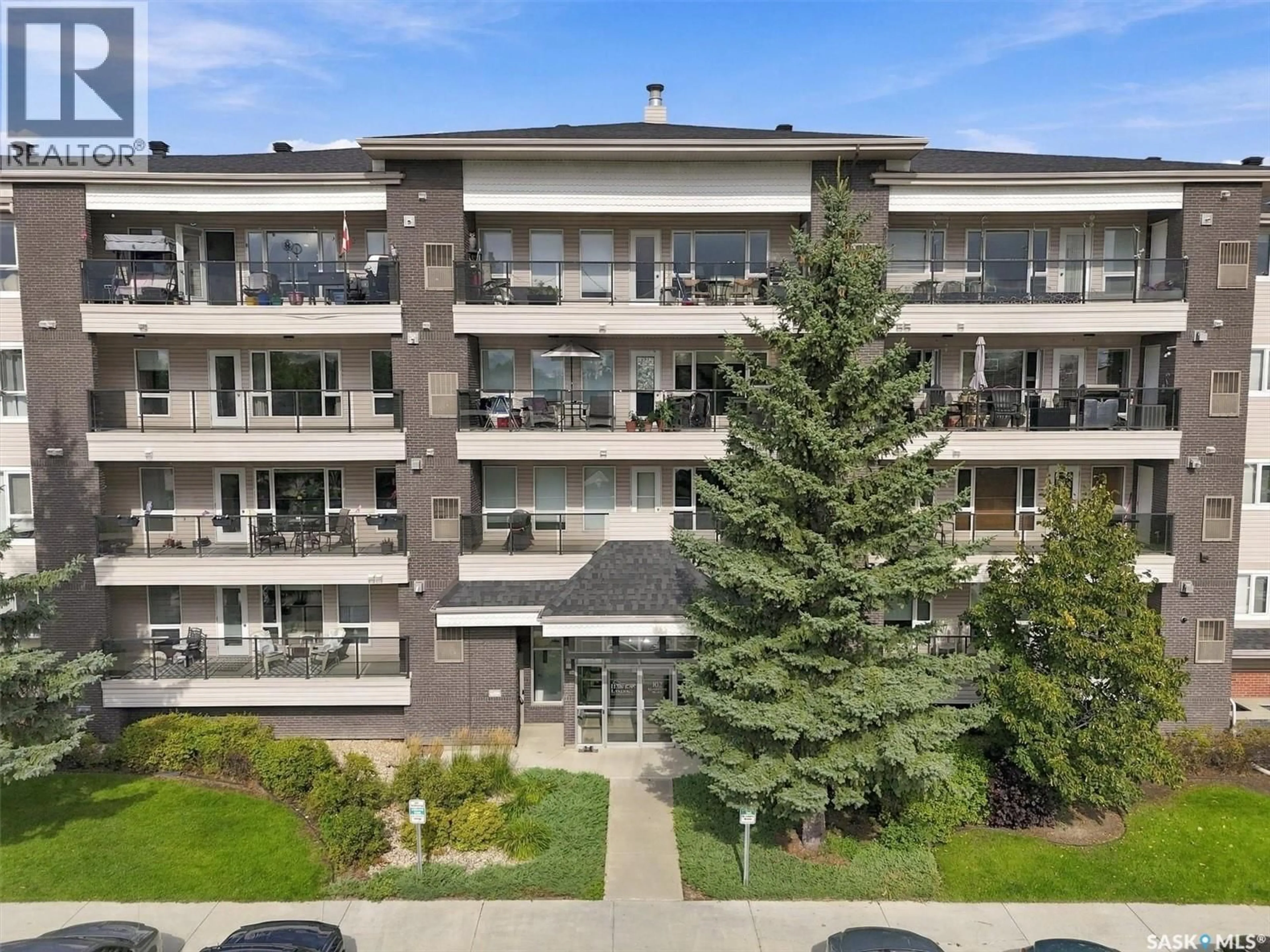 A pic from outside/outdoor area/front of a property/back of a property/a pic from drone, unknown for 102 - 312 KINGSMERE PLACE, Saskatoon Saskatchewan S7J2K3