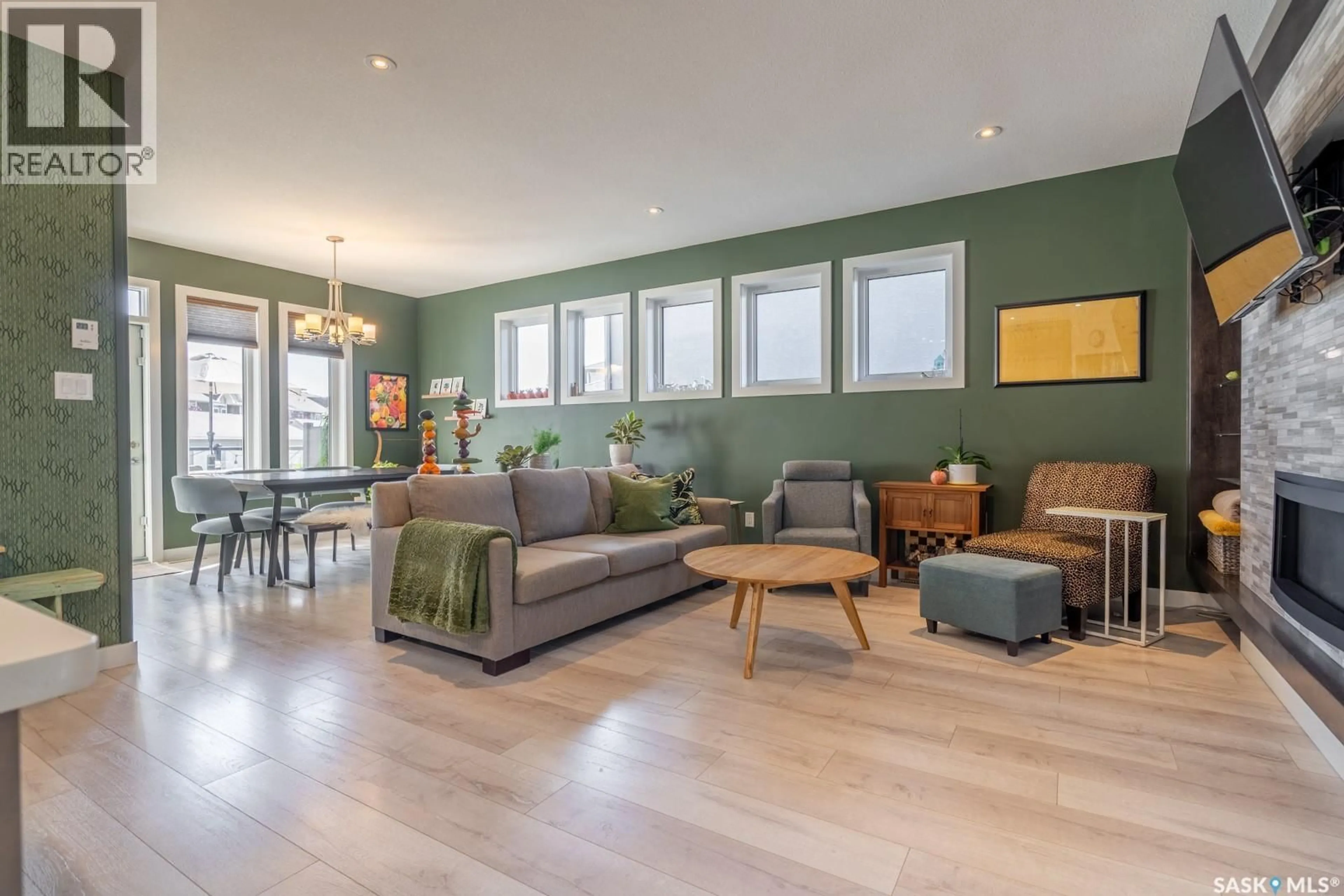 Living room with furniture, wood/laminate floor for 4126 GREEN OLIVE WAY, Regina Saskatchewan S4V1P8