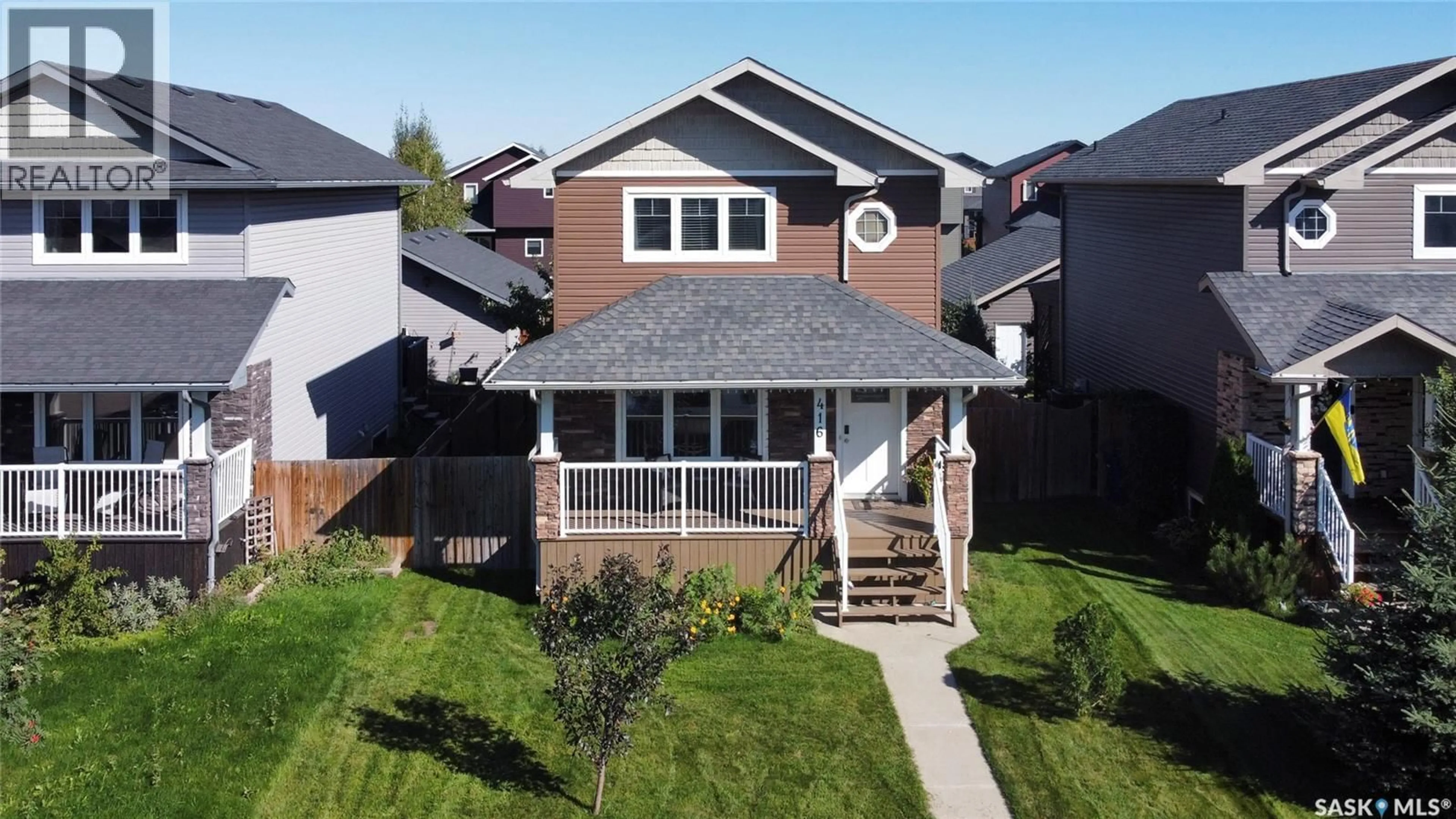 Home with vinyl exterior material, street for 416 REDWOOD CRESCENT, Warman Saskatchewan S0K0A1