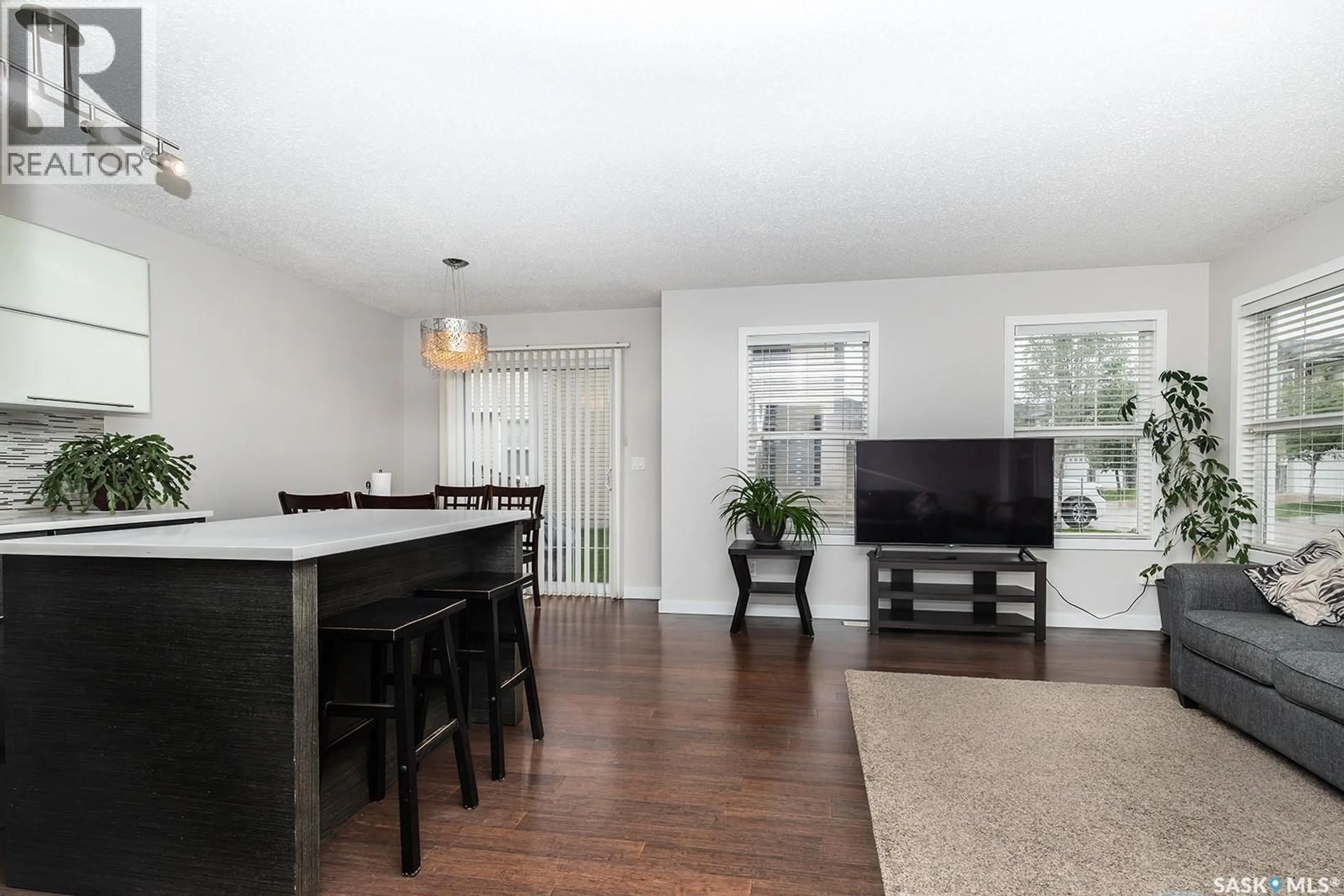 Open concept kitchen, wood/laminate floor for 410 - 211 LEDINGHAM WAY, Saskatoon Saskatchewan S7V0C4