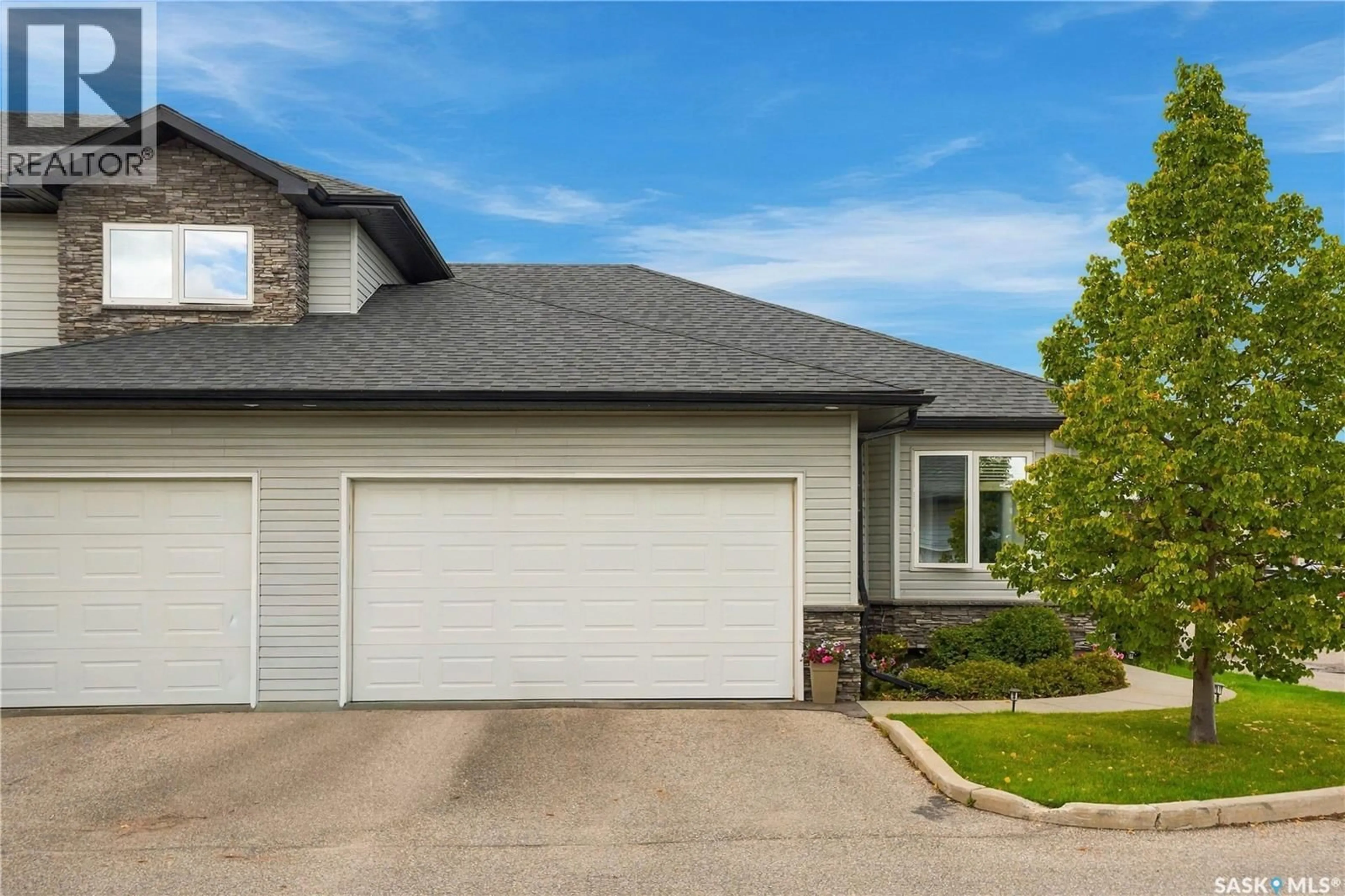 Home with vinyl exterior material, street for 23 547 EAST HAMPTON BOULEVARD, Saskatoon Saskatchewan S7R0H8