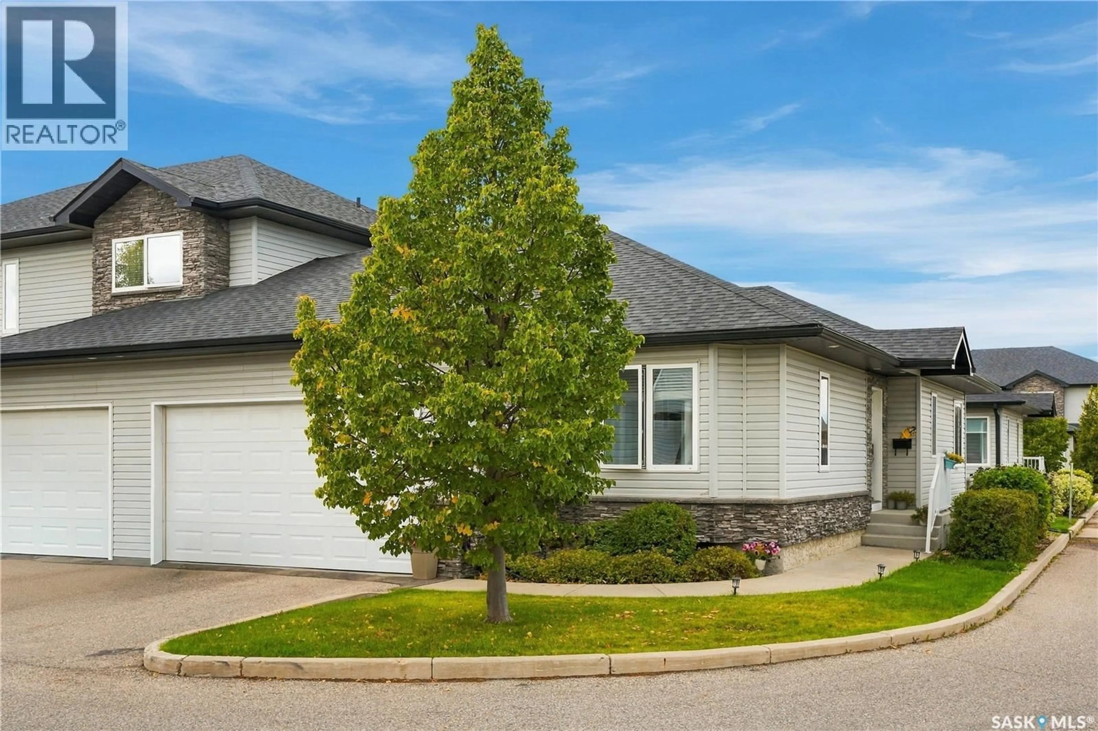 Home with vinyl exterior material, street for 23 547 EAST HAMPTON BOULEVARD, Saskatoon Saskatchewan S7R0H8
