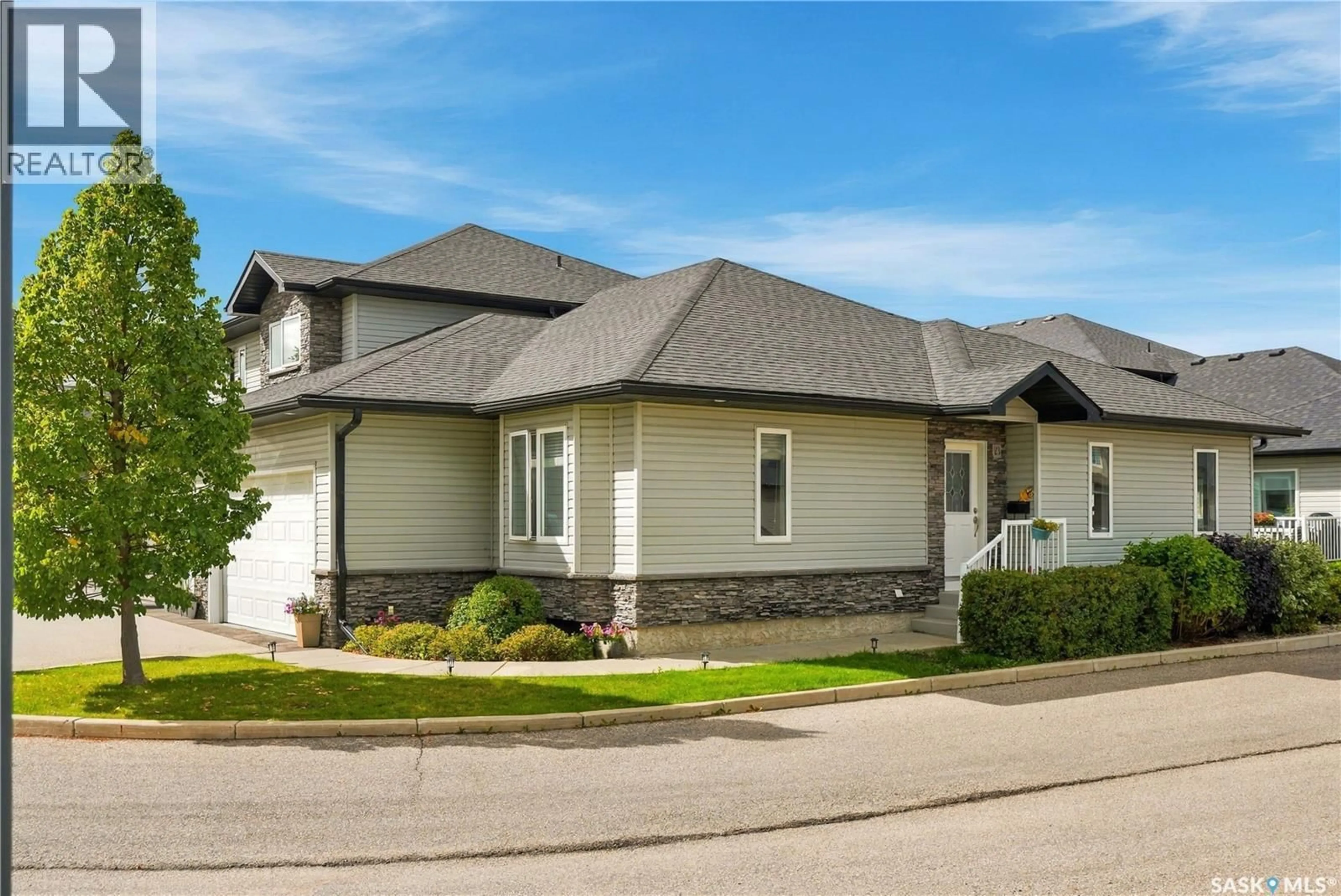 Home with vinyl exterior material, street for 23 547 EAST HAMPTON BOULEVARD, Saskatoon Saskatchewan S7R0H8