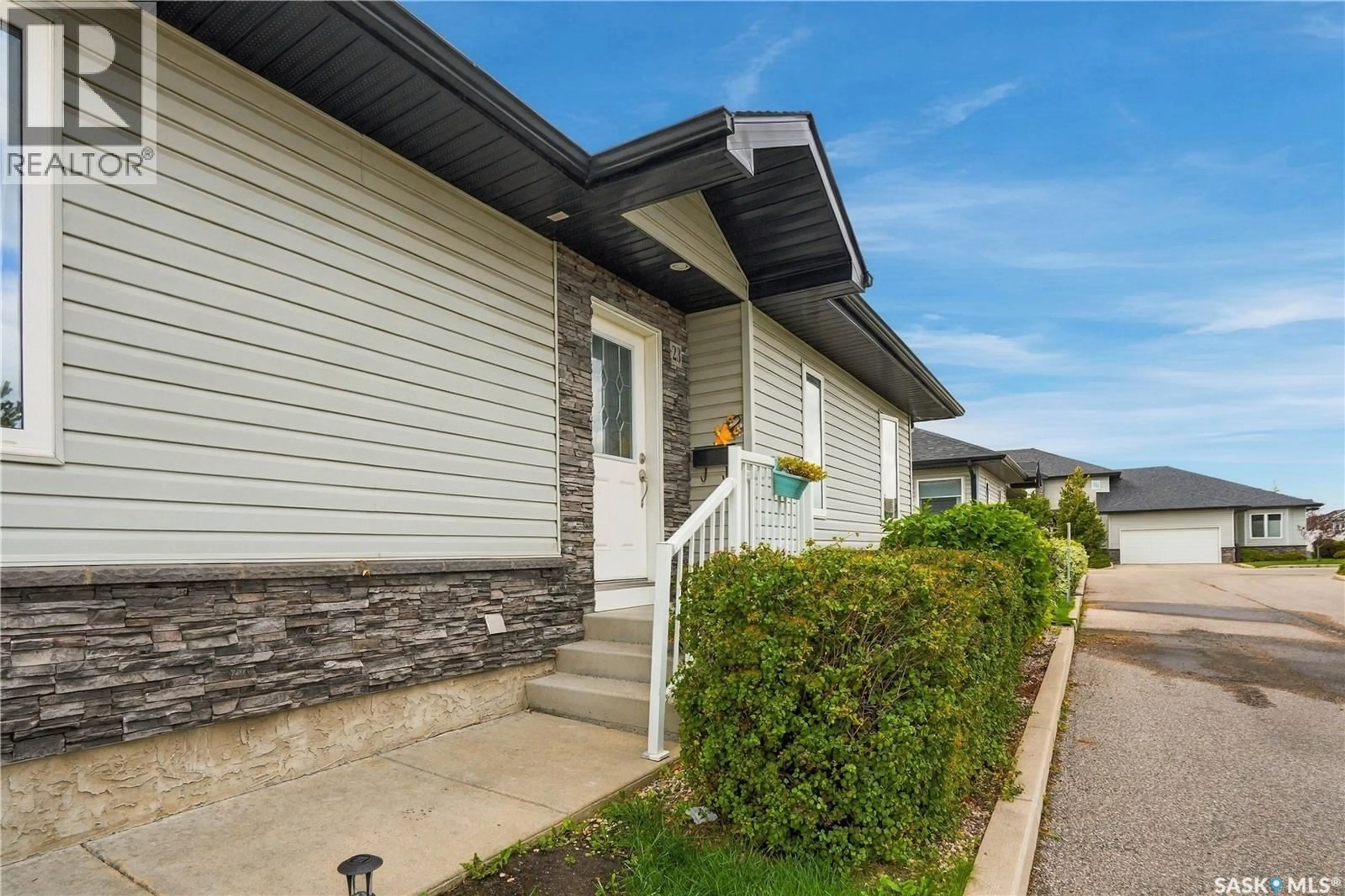 Home with vinyl exterior material, street for 23 547 EAST HAMPTON BOULEVARD, Saskatoon Saskatchewan S7R0H8