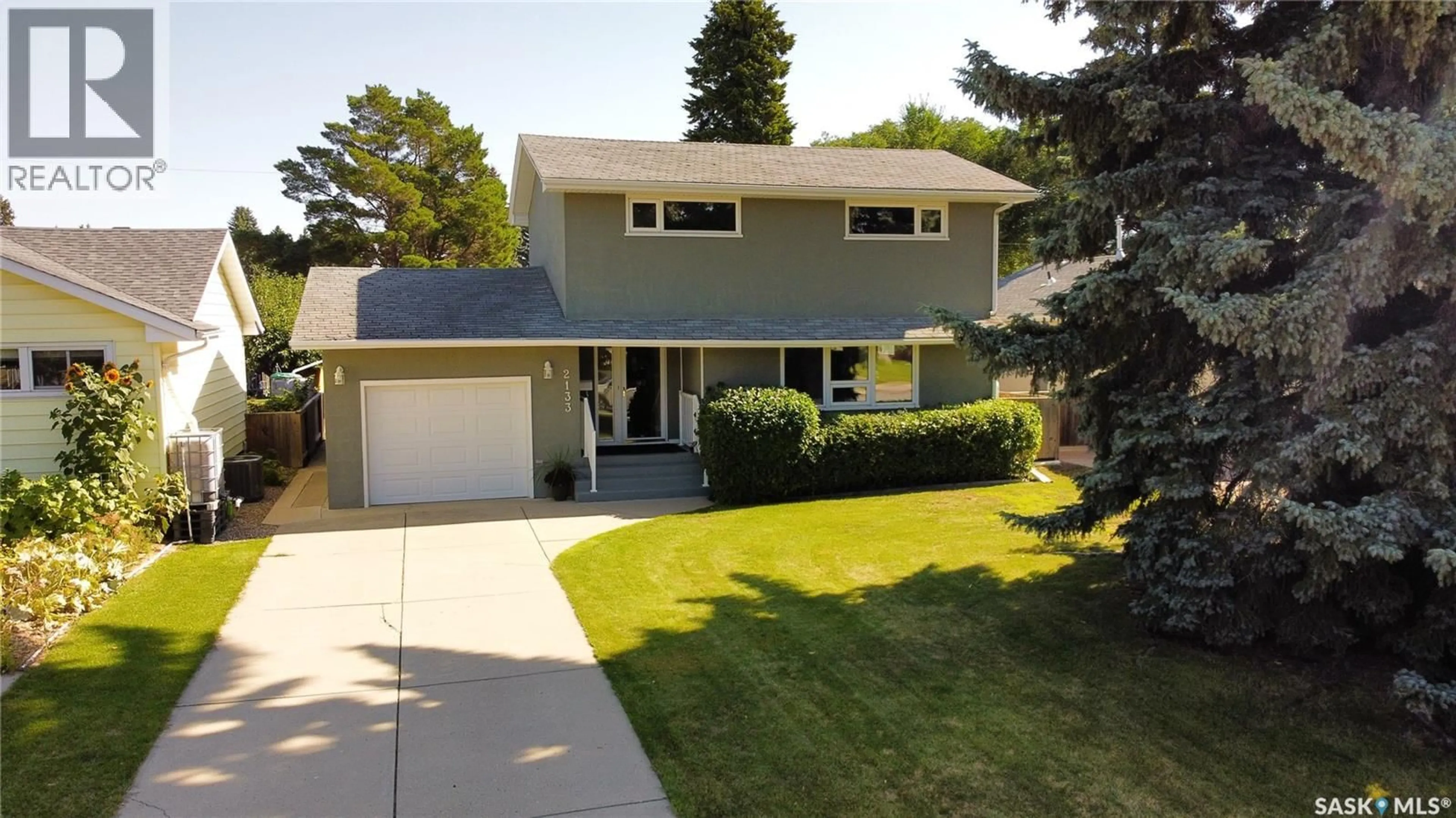 Home with vinyl exterior material, street for 2133 MCKINNON AVENUE, Saskatoon Saskatchewan S7J1N3