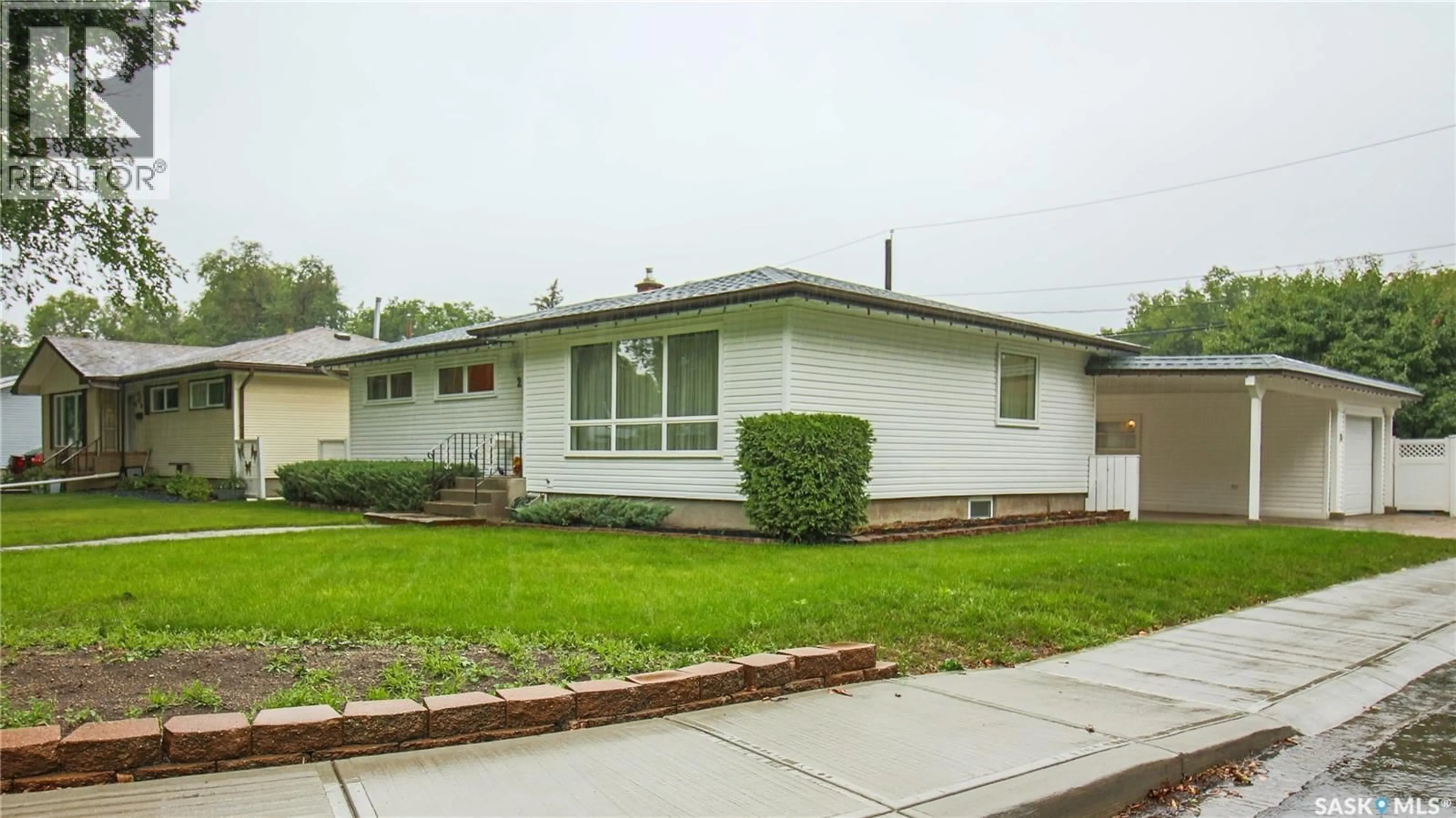 Home with vinyl exterior material, street for 2 MALONE CRESCENT, Regina Saskatchewan S4S5R2