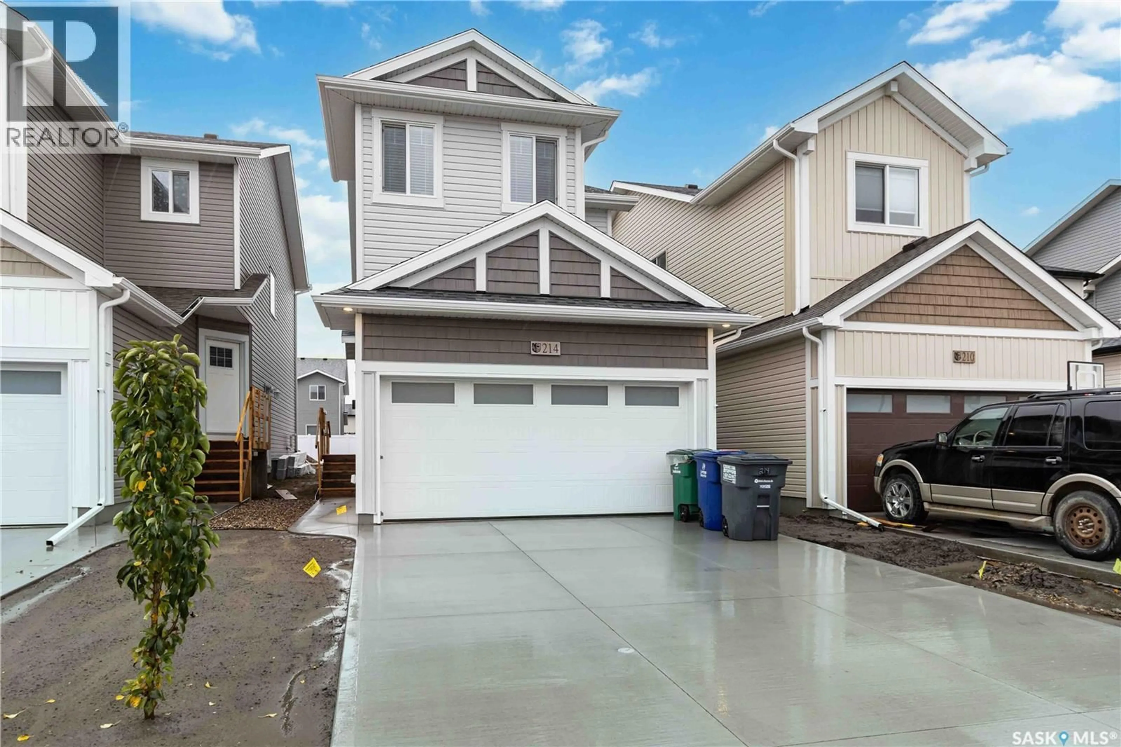 Home with vinyl exterior material, street for 214 ANTONINI COURT, Saskatoon Saskatchewan S7L7P3