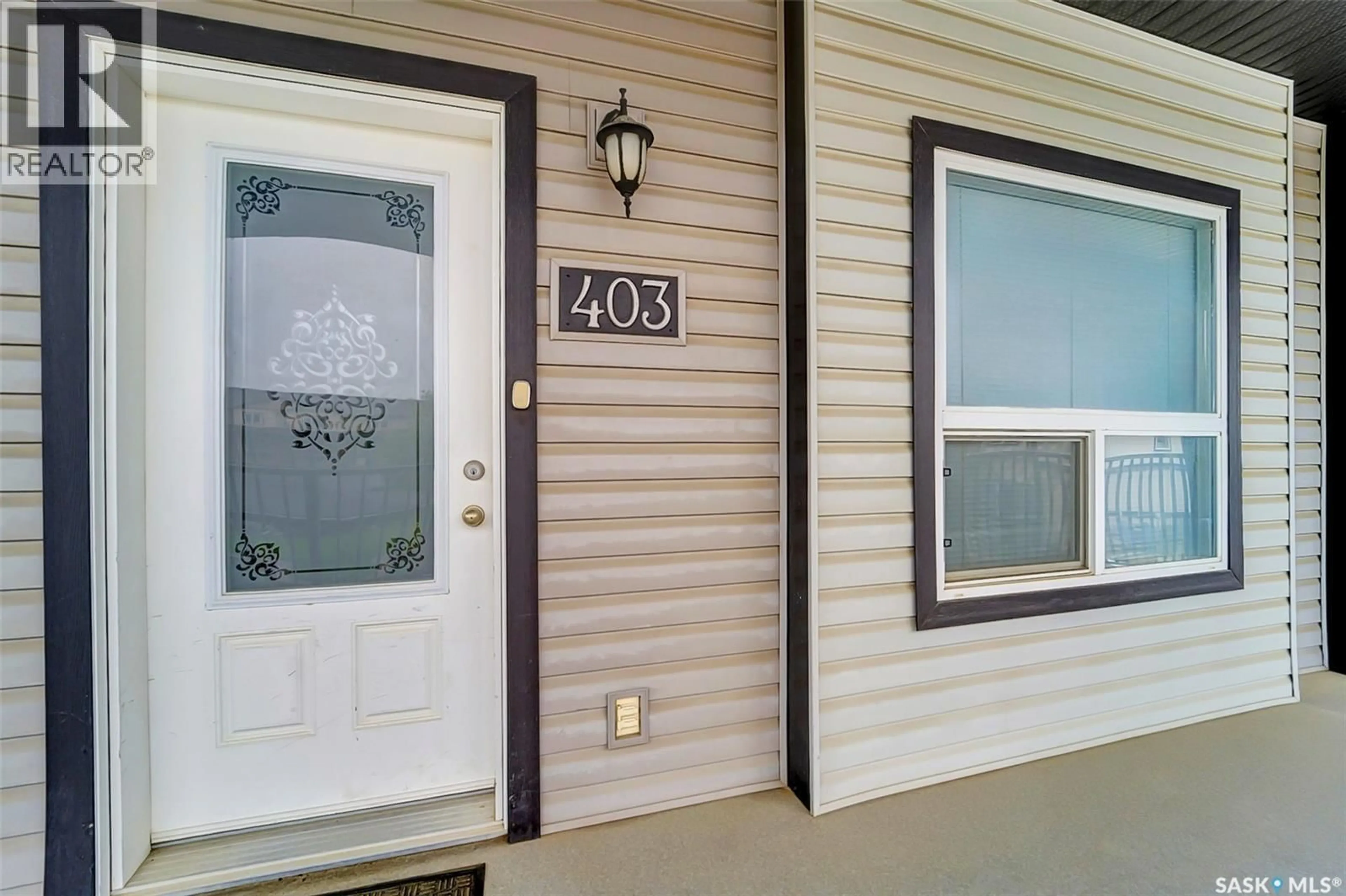 Home with vinyl exterior material, street for 403 103 KLASSEN CRESCENT, Saskatoon Saskatchewan S7R0G1