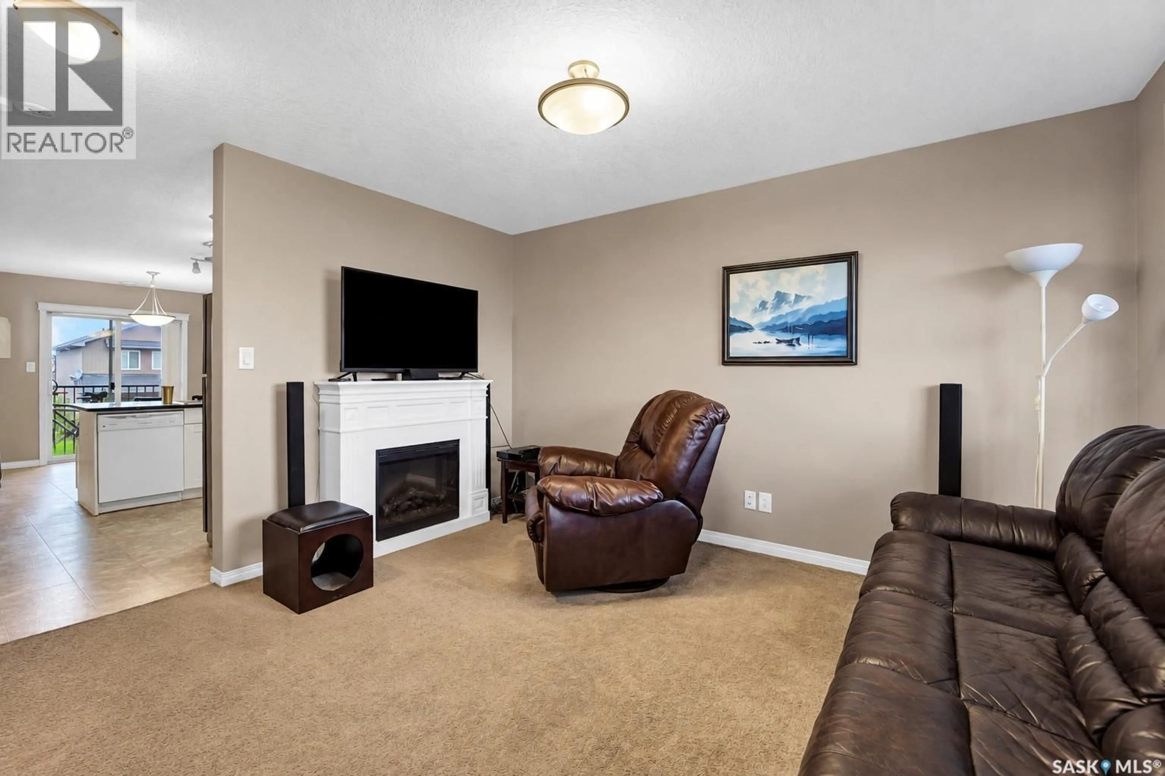Living room with furniture, carpet floor for 403 103 KLASSEN CRESCENT, Saskatoon Saskatchewan S7R0G1