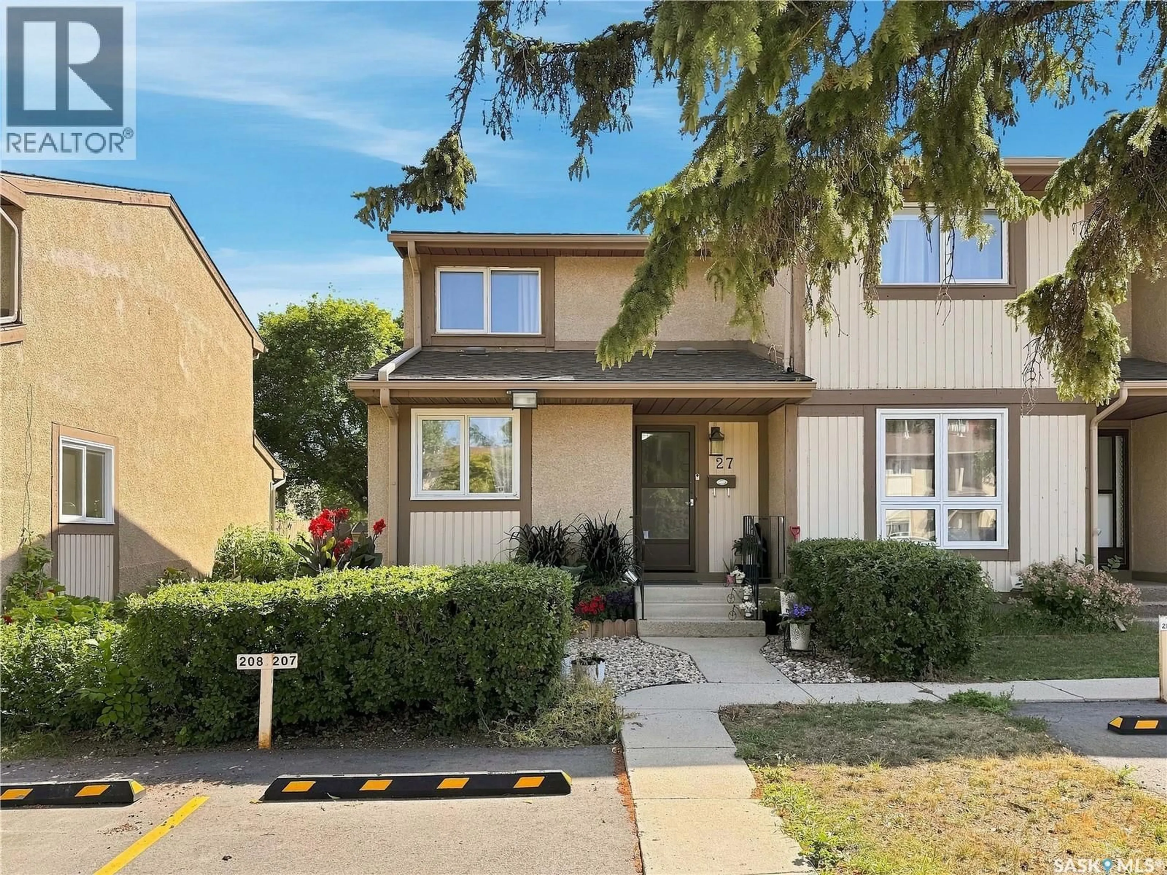 Home with vinyl exterior material, street for 1128 - 27 MCKERCHER DRIVE, Saskatoon Saskatchewan S7H4Y7