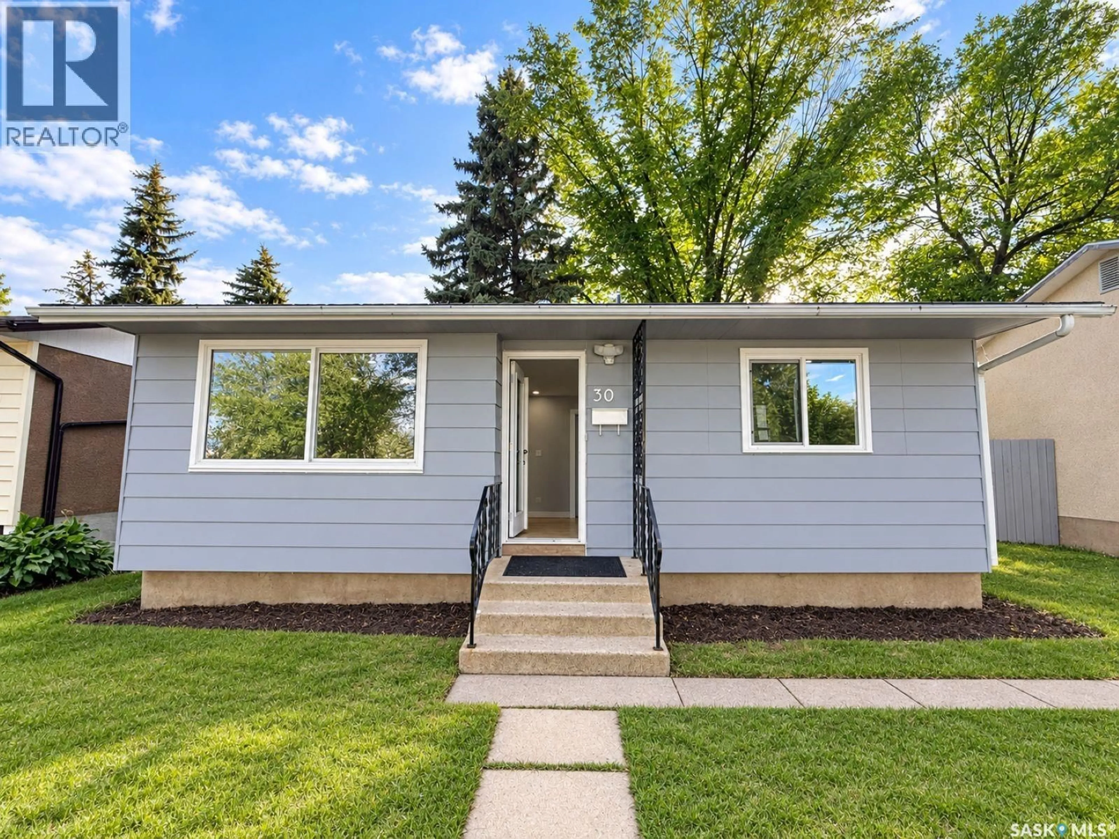 Home with vinyl exterior material, street for 30 CONFEDERATION CRESCENT, Saskatoon Saskatchewan S7L4V2