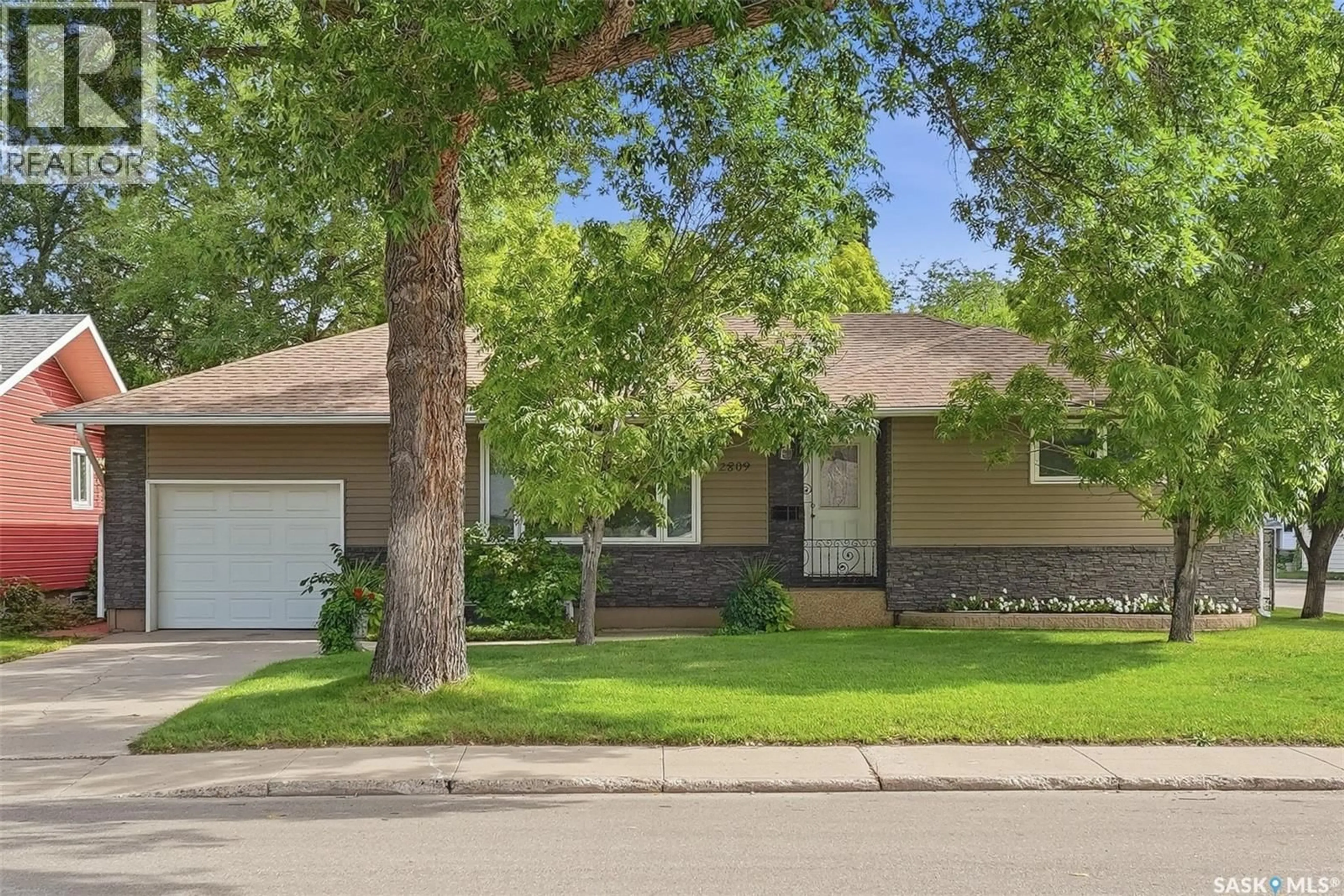 Home with vinyl exterior material, street for 2809 CLARENCE AVENUE, Saskatoon Saskatchewan S7J1M7