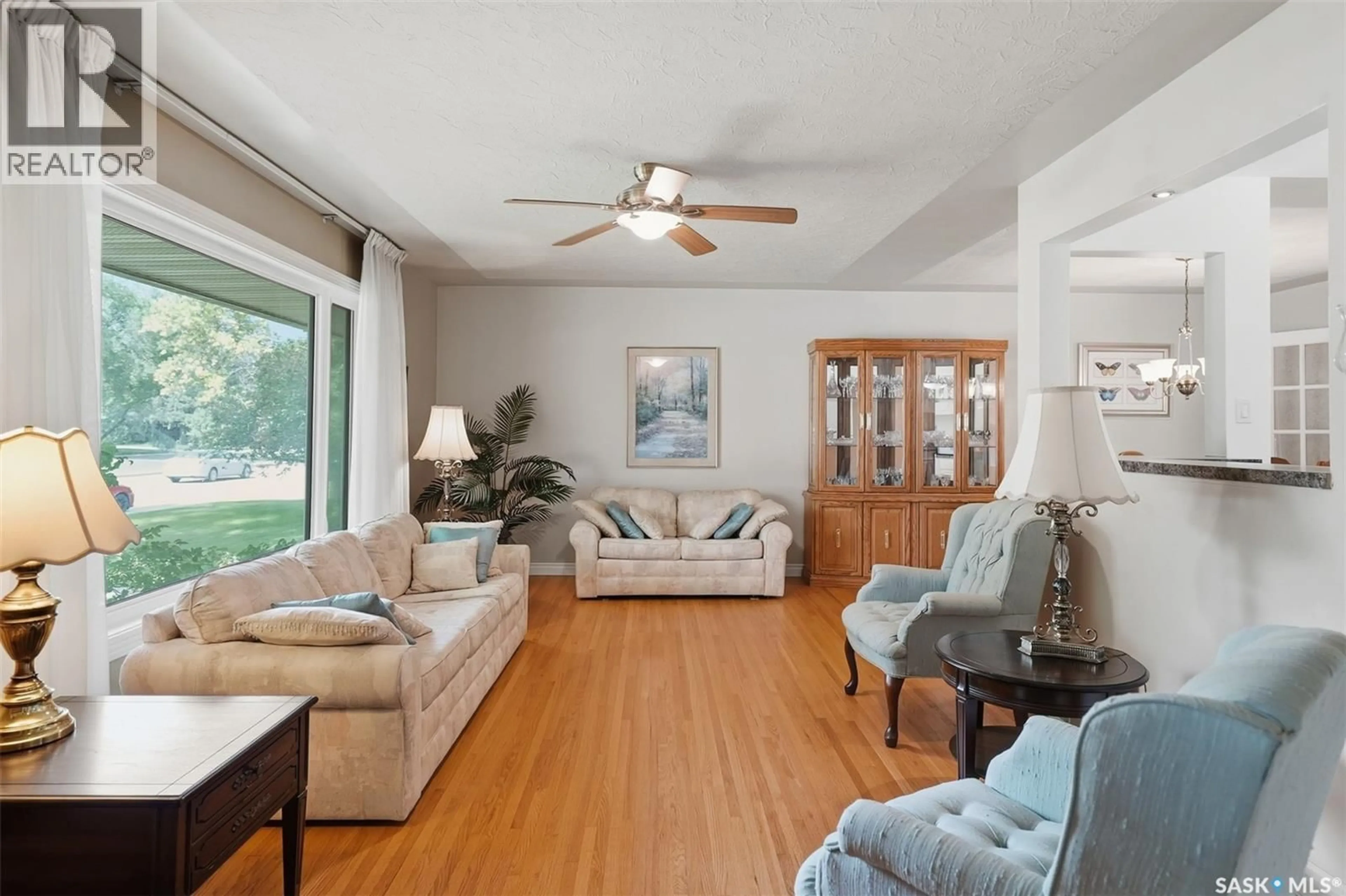 Living room with furniture, wood/laminate floor for 2809 CLARENCE AVENUE, Saskatoon Saskatchewan S7J1M7
